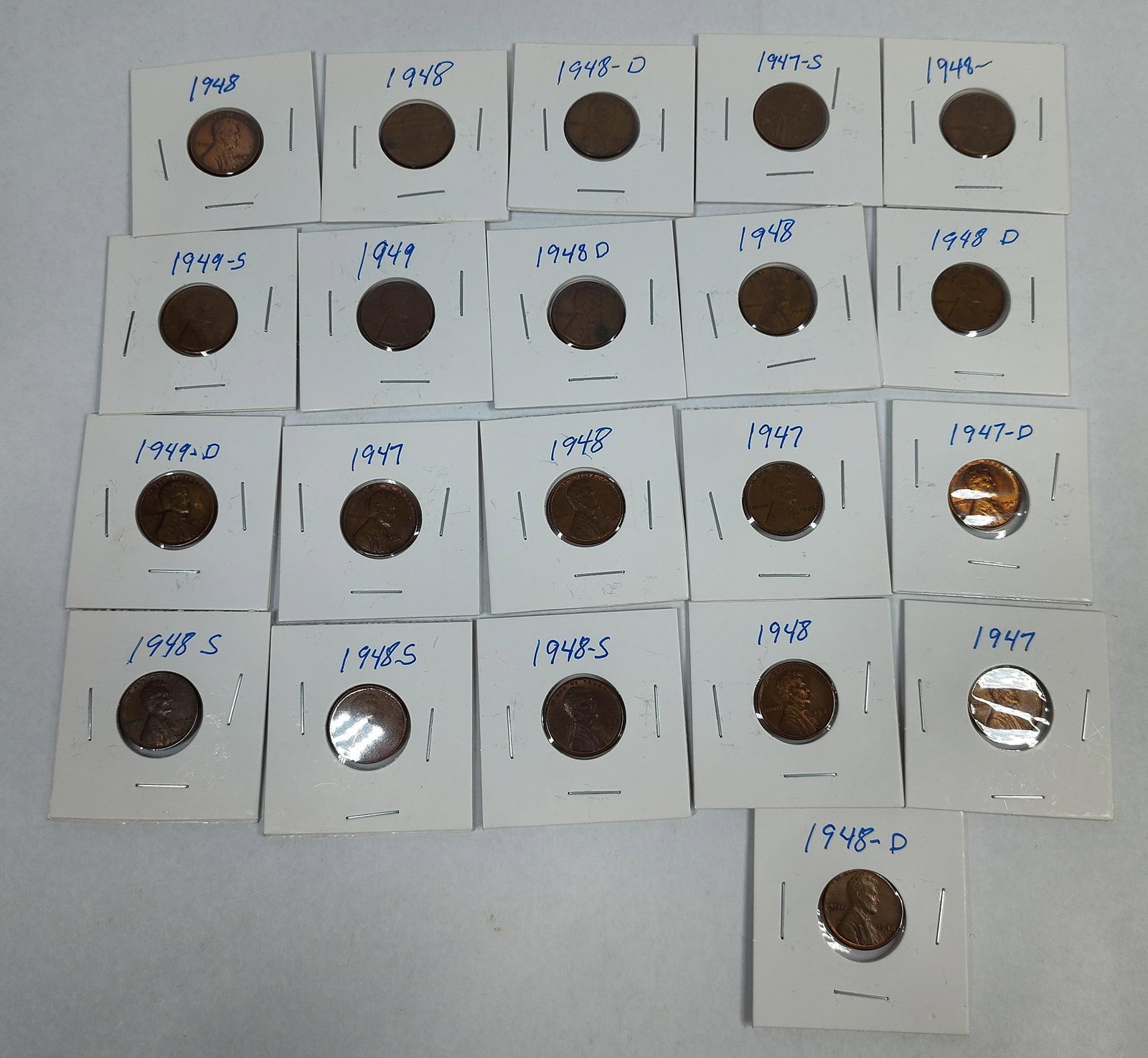 US Lincoln Wheat Cents, 1947-1949: A collection of US Lincoln Wheat Cents issued between 1947 and 1949. The group includes specimens from the Philadelphia, Denver (D), and San Francisco (S) mints. Each coin is individually housed in a 