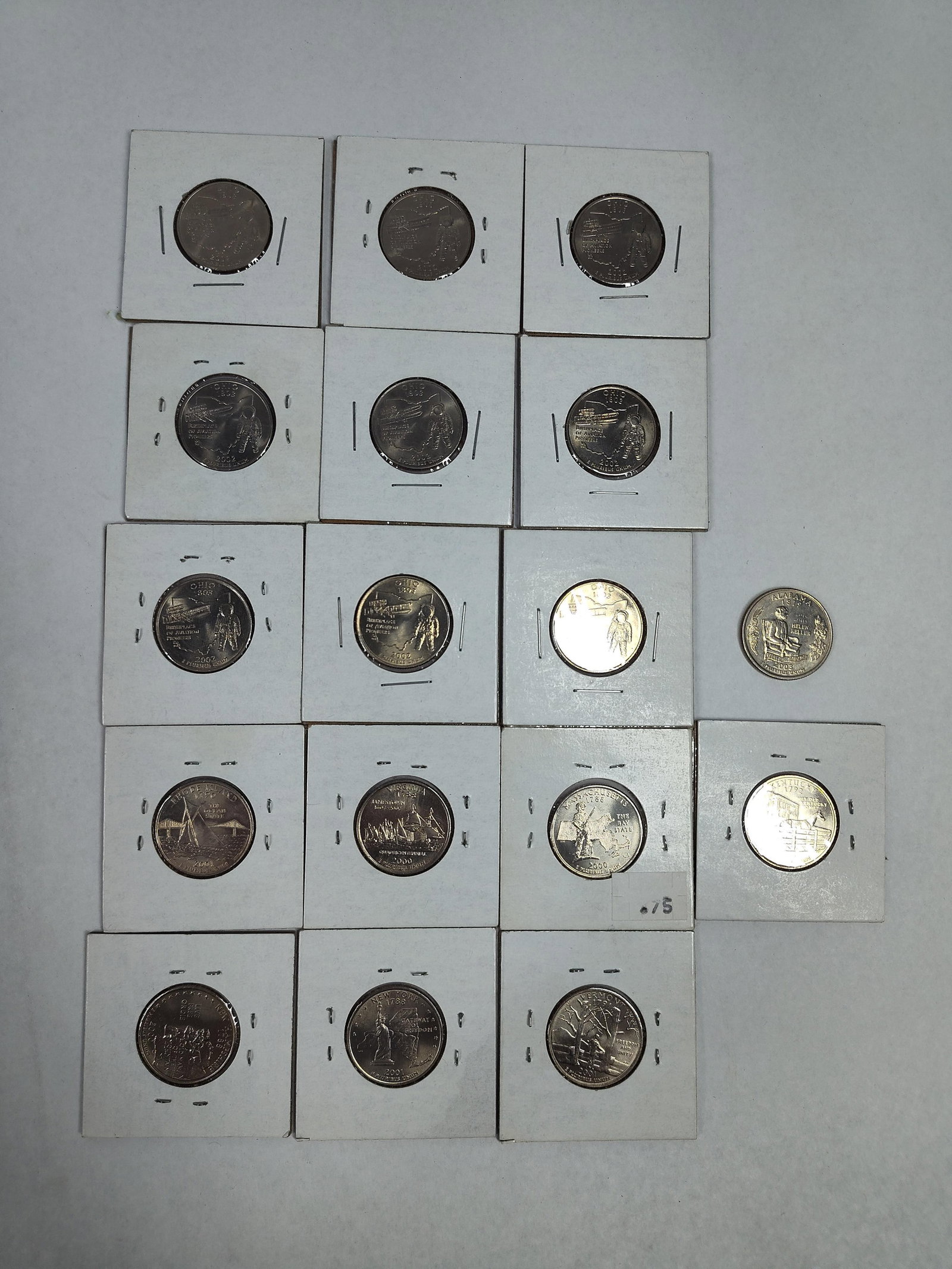 US Statehood Quarters, 2000-2003: A collection of US Statehood quarters featuring various reverse designs issued between 2000 and 2003. The group includes multiple examples of the 2002 Ohio "Birthplace of Aviation Pioneers" is