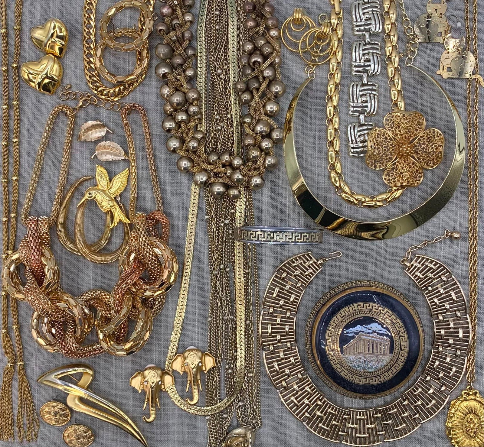Chico's Modernist Brooch & Vtg Jewelry: This collection of vintage costume jewelry features an assortment of styles primarily from the mid-to-late 20th century, rendered in gold-tone and mixed metal finishes. The lot includes a variety of s