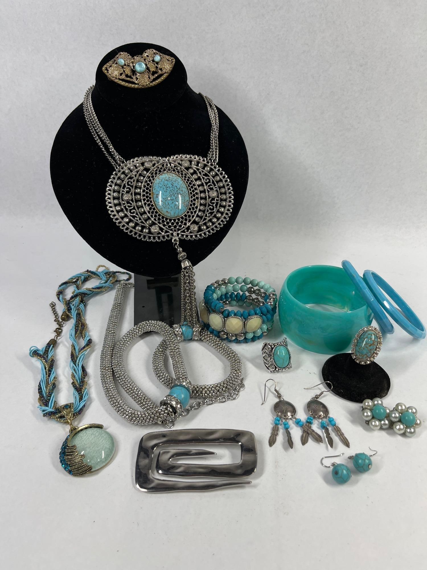 Vtg Blue & Silver Jewelry & Accessories: This assortment of costume jewelry and accessories features a cohesive color palette of turquoise blue, aqua, and silver tones. The collection includes a large silver-tone bib necklace with openwork f