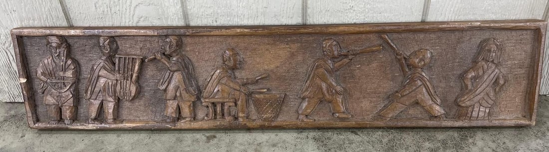 Andean Wood Musical Procession Relief: 7x35.5 This rectangular hand carved wood relief panel depicts a procession of figures in an Andean folk art style, likely from Peru or Bolivia. The scene features seven stylized figures, including six