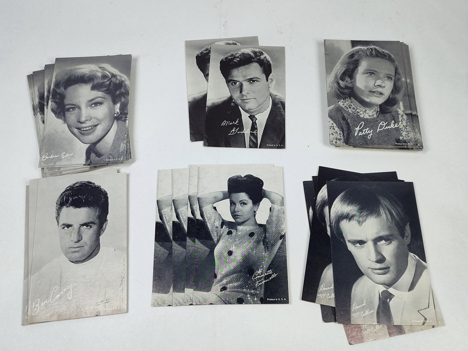1960s Celebrity Arcade Trading Cards: A collection of vintage black and white lithographed celebrity portrait cards produced for distribution through arcade vending machines during the 1960s. The cards are printed on heavy cardstock and f