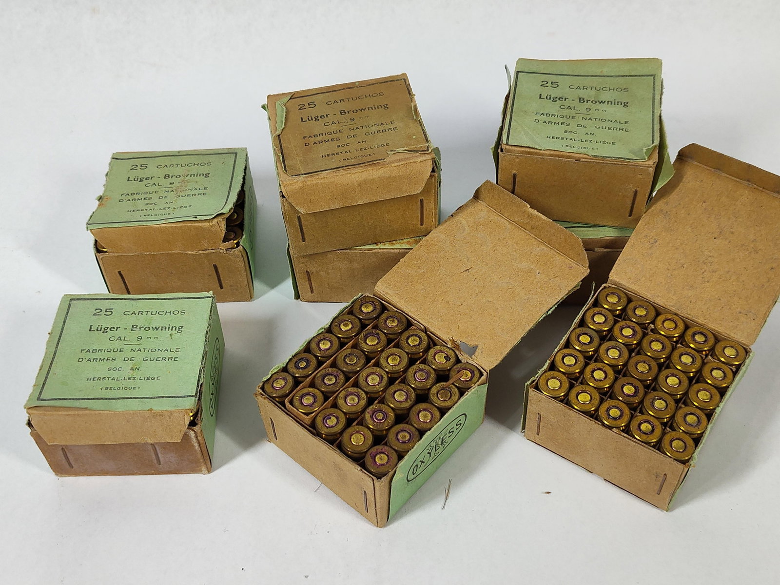 Fabrique Nationale 9mm Luger Ammo 1947: This lot consists of eight individual 25-round boxes of vintage 9mm ammunition manufactured by Fabrique Nationale d'Armes de Guerre in Herstal, Belgium, for a total of 200 cartridges. The ammuniti
