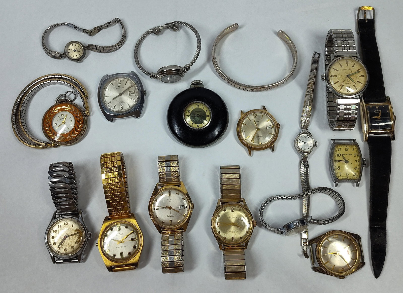 Vtg Wrist & Pocket Watches & Jewelry: A varied collection of approximately sixteen vintage timepieces and two jewelry items. The assortment includes wristwatches from manufacturers such as Helbros, Timex, Elgin, Waltham, Schwob, Genova