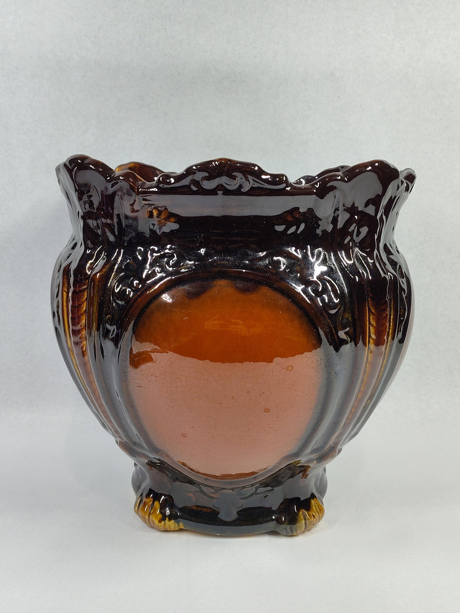 American Rockingham Footed Jardiniere: 11x10 An American art pottery jardiniere or planter crafted from earthenware with a buff-colored yellowware body. The vessel features a bulbous form with a wide, flared rim characterized by deep