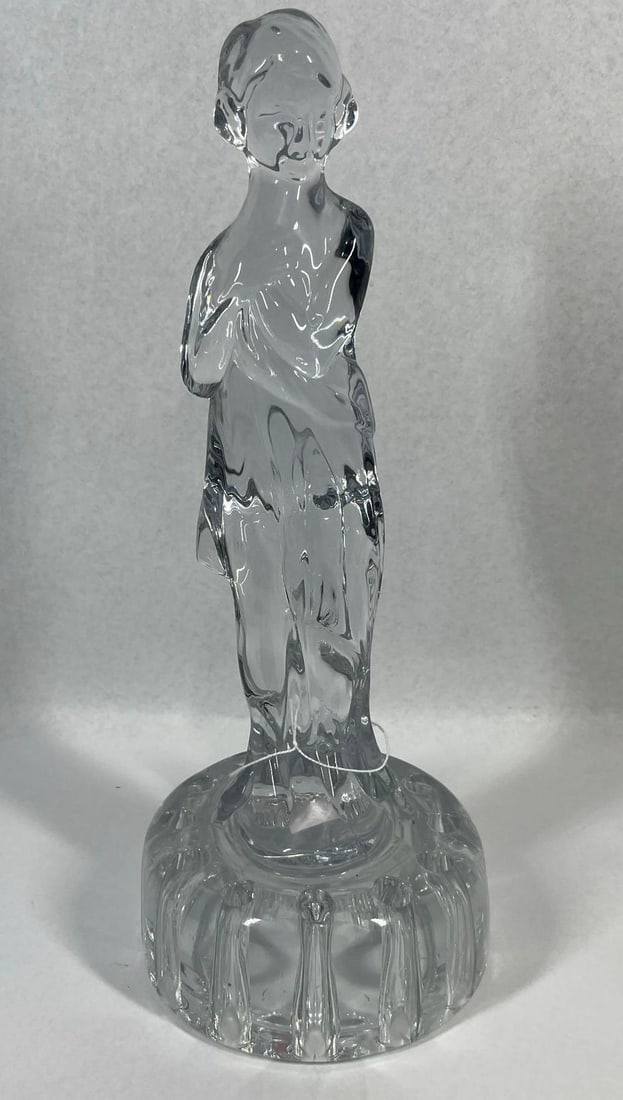 Attr. Cambridge Draped Lady Flower Frog: 13 inches. This Art Deco style molded clear glass flower frog figurine is attributed to the Cambridge Glass Company and features the Draped Lady pattern. The standing female figure is posed with arms 