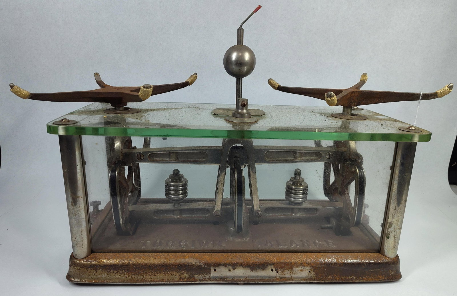 Torsion Balance Co. Apothecary Scale: 16x7.5x7 An antique precision torsion balance manufactured by The Torsion Balance Co. of New York and Jersey City. The instrument is housed within a protective enclosure featuring clear glass side