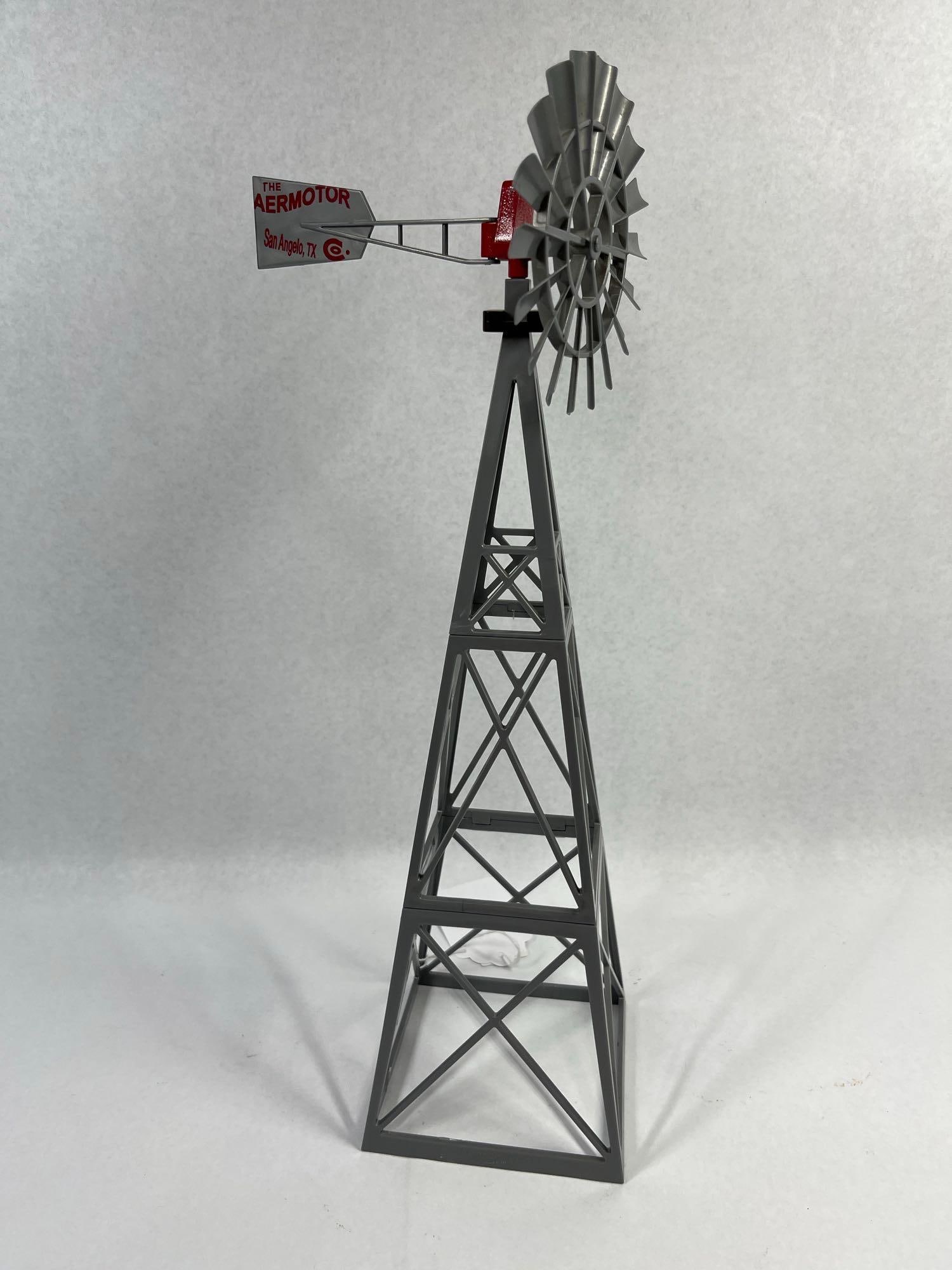 Big Country Toys Aermotor Farm Windmill: 15.5 in plastic. This item is a scale model toy farm windmill manufactured by Big Country Toys, replicating the signature design of the Aermotor Windmill Company. The piece is constructed from molded