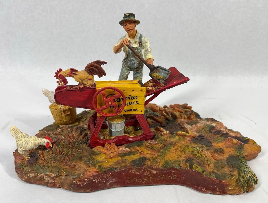 Ertl Lowell Davis Corn Sheller Figurine: 10.5x6. This has been repaired. This Ertl Foxfire Farm figurine, titled Easy Pickin's and created by artist Lowell Davis, depicts a detailed rural farm scene. The hand-painted diorama, likely