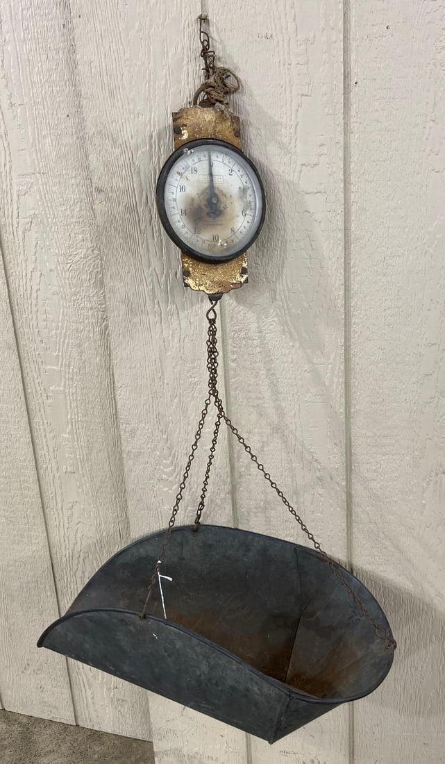 Landers Frary & Clark Scale w/ Scoop: This antique hanging grocer's spring scale was manufactured by Landers, Frary and Clark in New Britain, Connecticut. The scale features a circular dial protected by glass, mounted between two