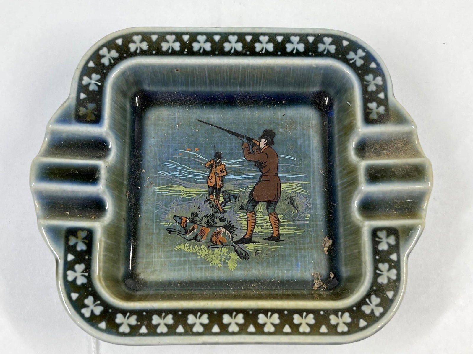 Wade Irish Porc. Sporting Scene Ashtray: 6x5 This square ceramic ashtray was produced by Wade Irish Porcelain, likely in Co. Armagh, Ireland. The piece is finished in a high-gloss mottled blue and green glaze characteristic of the maker.