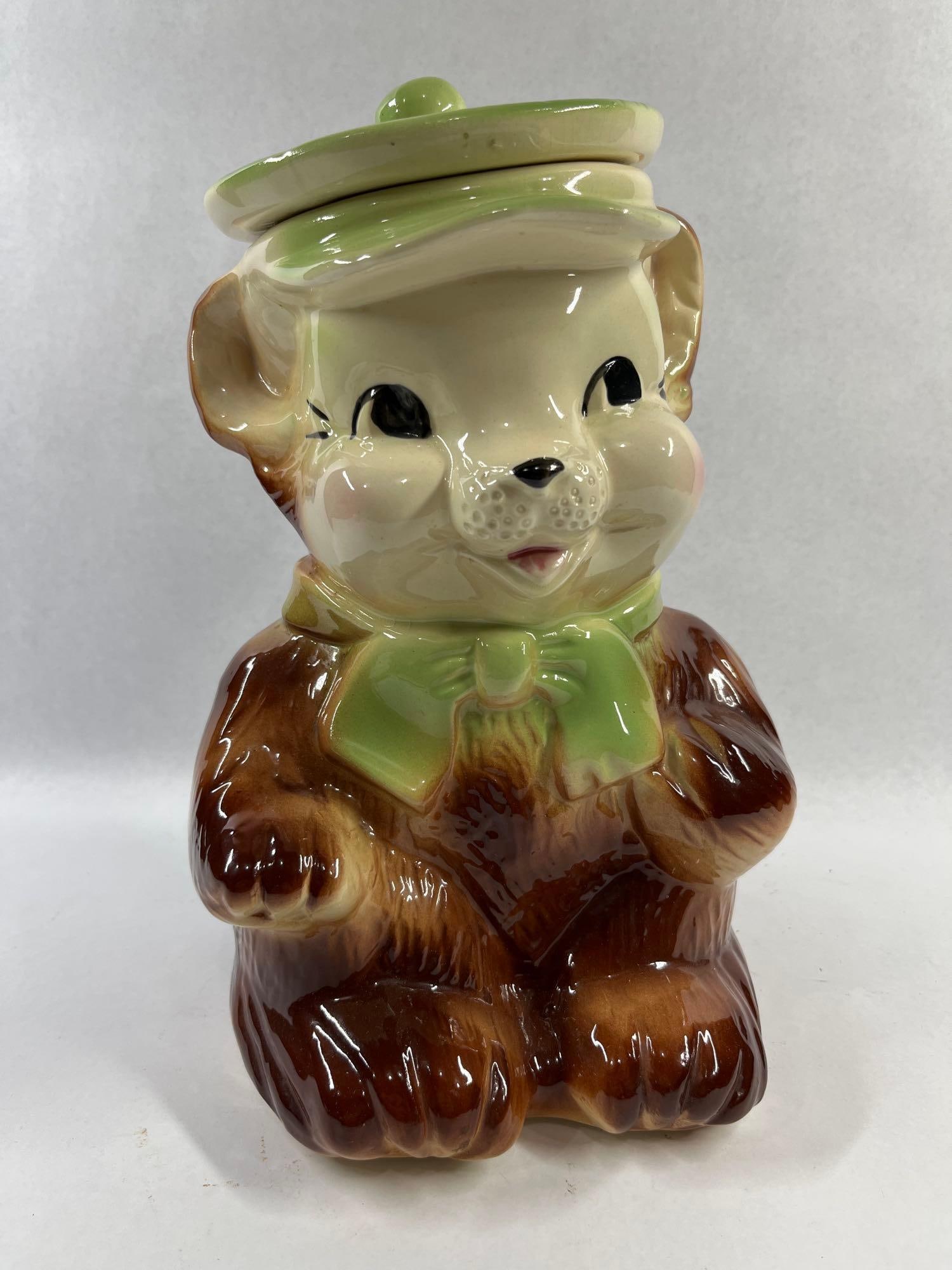American Bisque Pottery Bear Cookie Jar: 11.5 inches. Attributed to the American Bisque Company, this mid-century glazed ceramic cookie jar is modeled as a seated brown bear. The piece features a high-gloss brown glaze with molded texture
