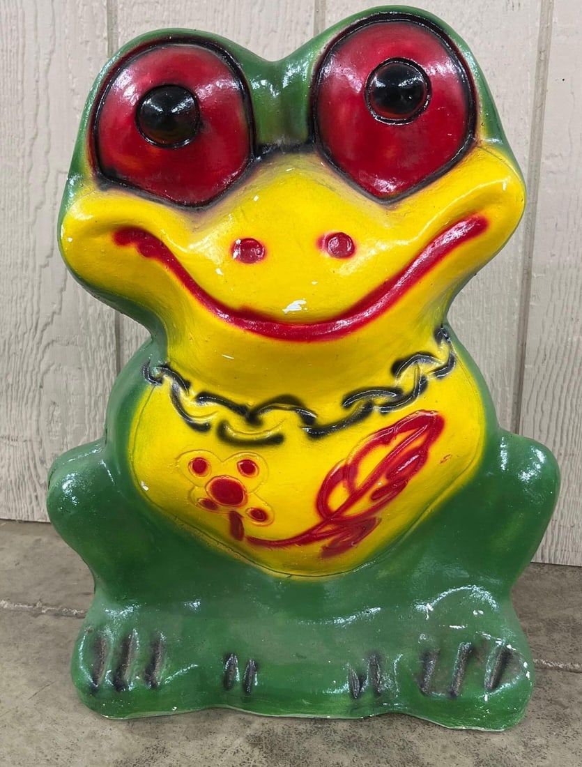 Hand-Painted Chalkware Frog Coin Bank: 19 inches. A large vintage novelty coin bank depicting a seated frog with exaggerated features. The bank is constructed from cast plaster, a material known as chalkware, and is finished with a
