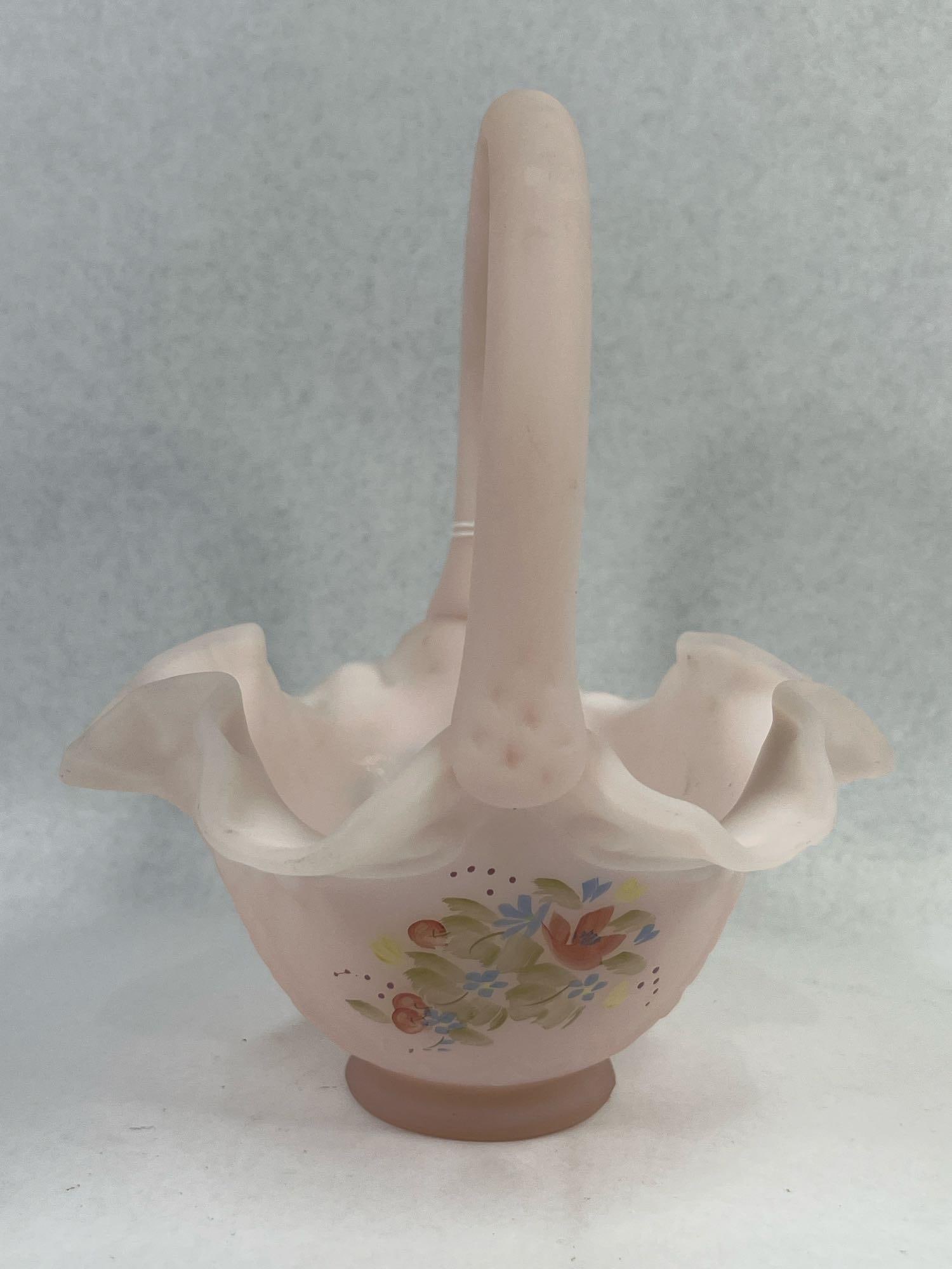 Fenton Rosalene Basket Signed D. Gessel: 6x6x7 This footed art glass basket is produced in Fenton Rosalene glass, which is an opaque pink glass with a soft matte satin finish. The form features a wide, deeply ruffled rim and an arched,