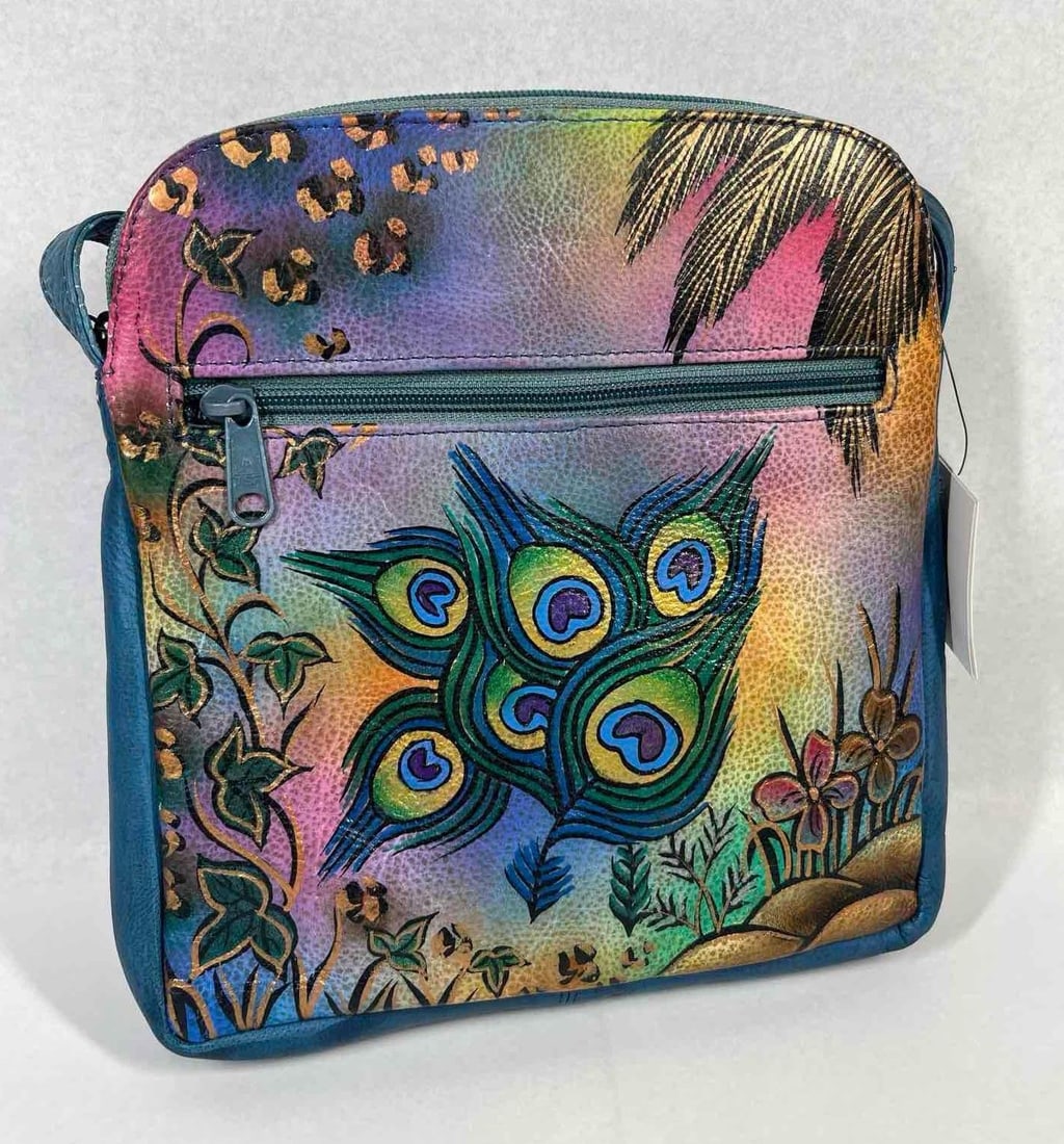 Biacci Peacock Leather Crossbody Bag: Hand-painted leather crossbody bag produced by Biacci, featuring a vibrant tropical peacock motif. The bag is constructed from grained leather with a multi-color palette of teal blue, pink, purple,