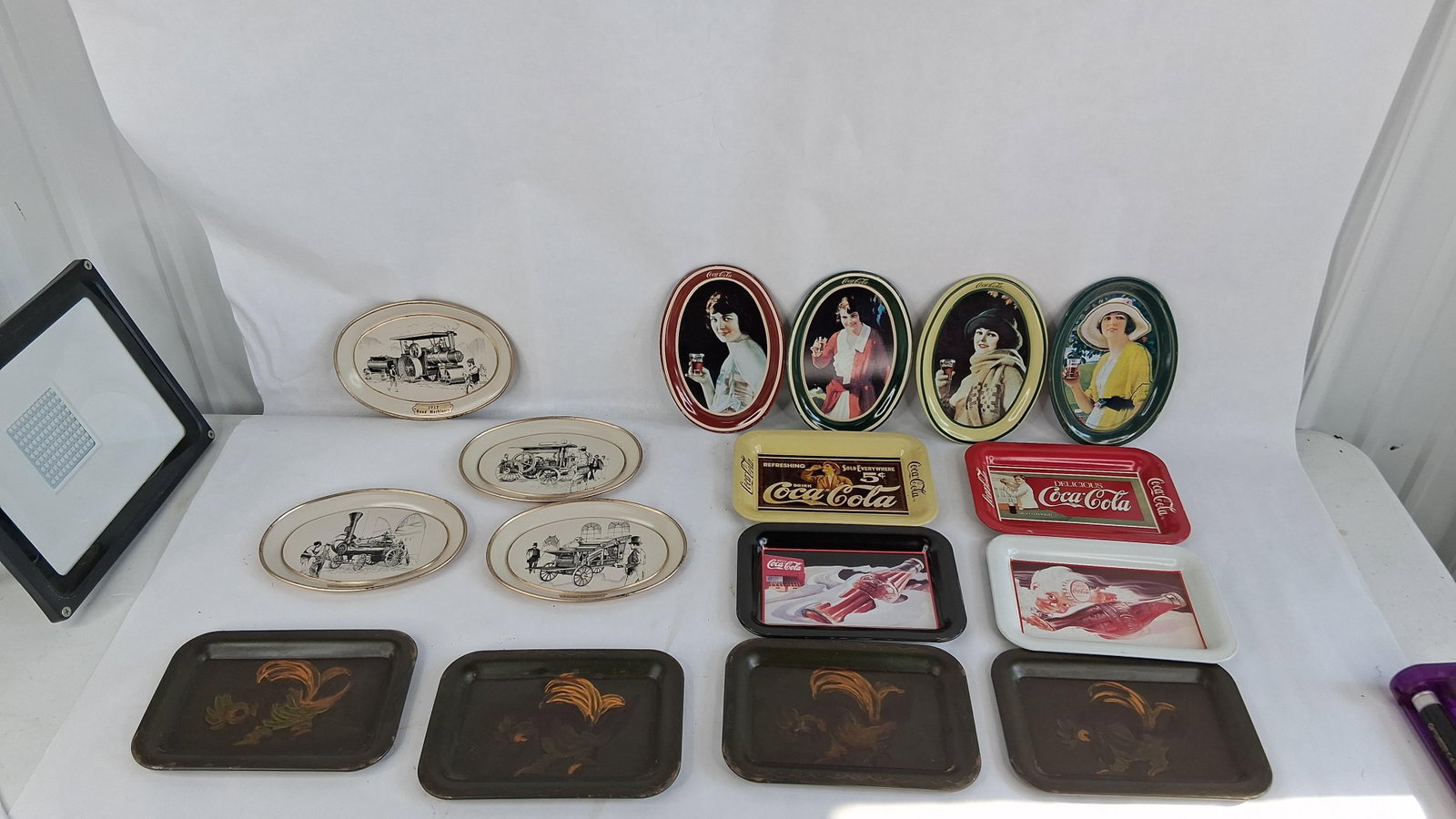 15 Advertising Lithographed Metal Trays: oval trays 6.5in long rectangular are 6.5x4.5 A grouping of 15 miniature lithographed metal advertising and decorative tip trays representing three distinct series. The first series includes seven