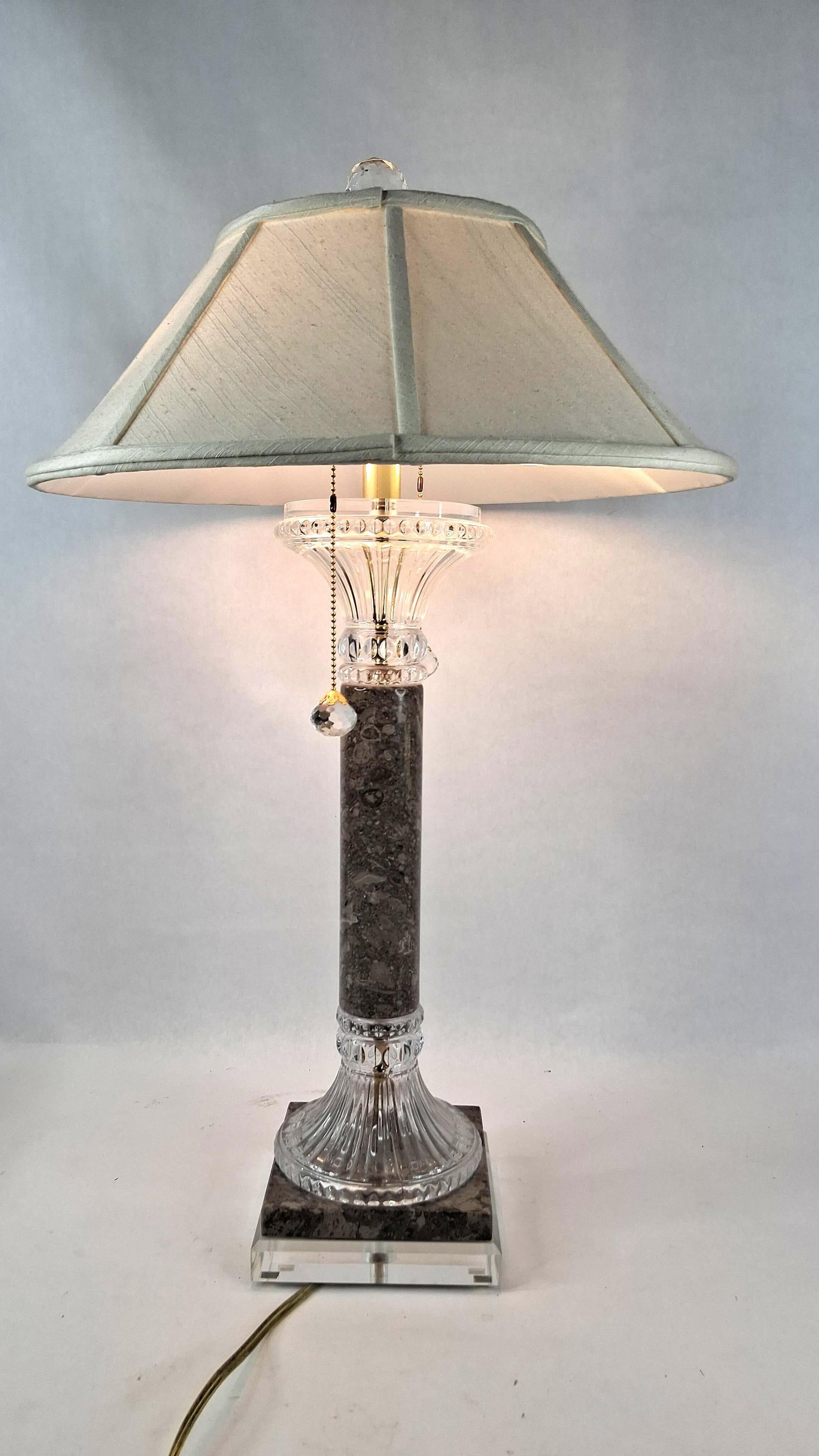 Neoclassical Fossil Marble Table Lamp: 6.5x6.5 base 28 in tall This decorative table lamp is designed in a Neoclassical Revival style, attributed to Concord Simone and likely dating from the 1970s. The lamp features a central cylindrical