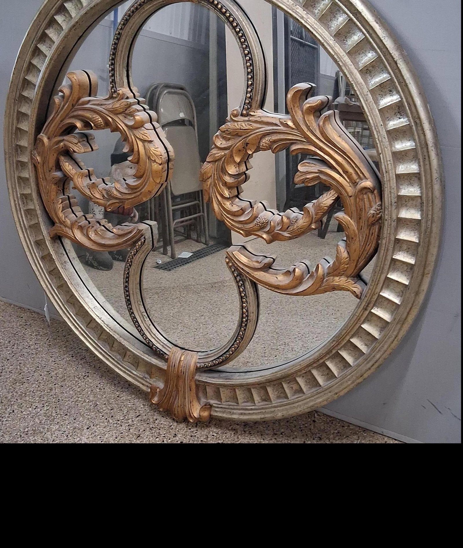 Hollywood Regency Gilt Circular Mirror: 52 in Large Hollywood Regency style circular wall mirror, likely produced in the late 20th century. The mirror is constructed with a molded composite frame finished in antiqued gold and silver-tone