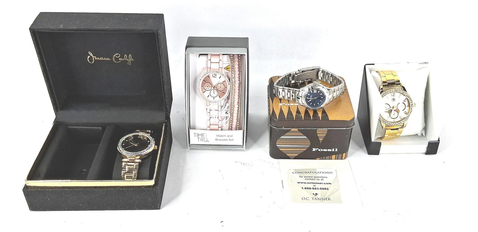4 Watches: Fossil, Time & Tru & Others: A collection of four contemporary fashion watches from brands including Fossil, Time and Tru, Jessica Carlyle, and Umo Lorenzo. The Fossil stainless steel sport watch features a dark blue dial with lu