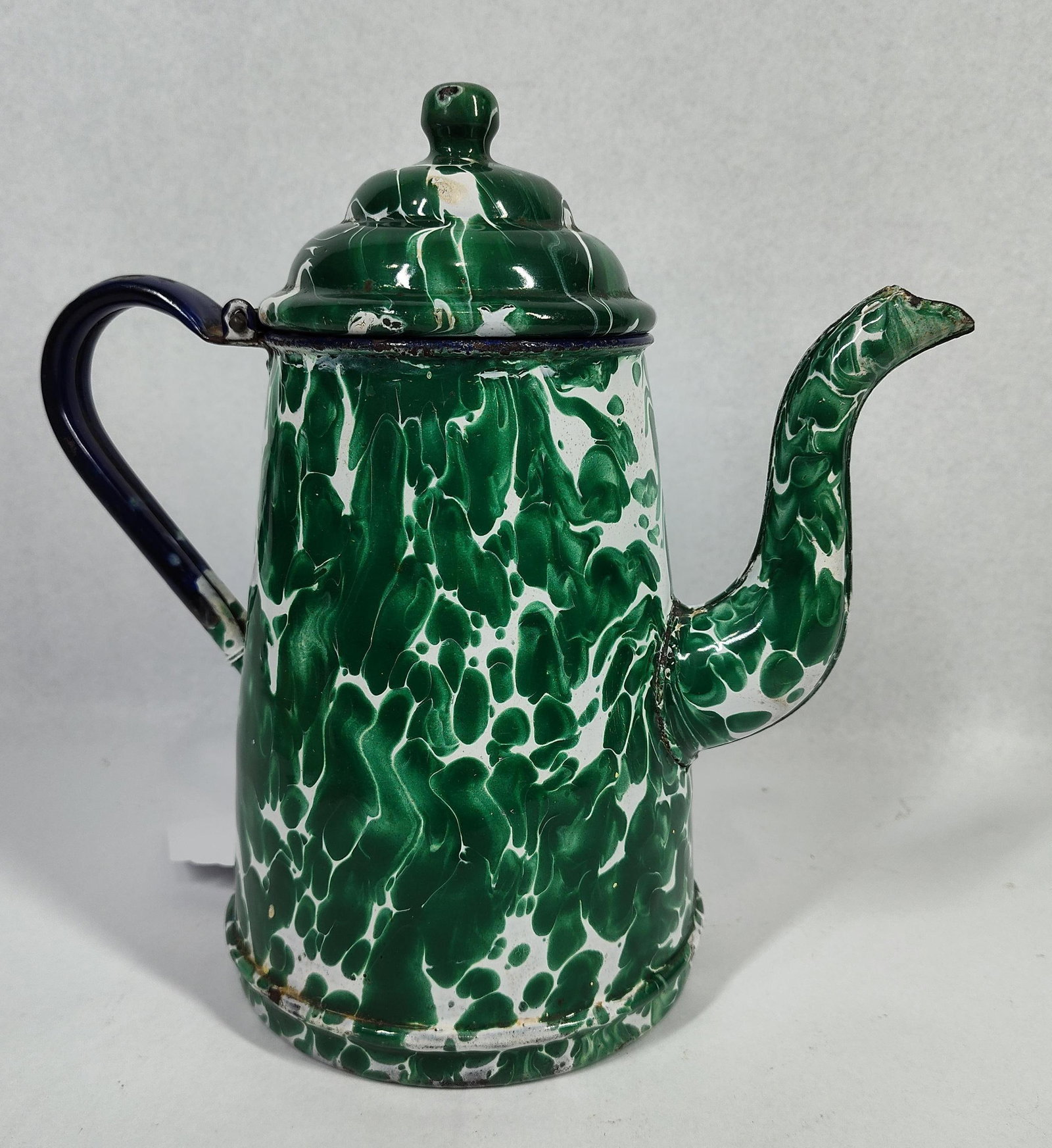 Green Swirl Graniteware Coffee Pot: This is a enamelware coffee pot, commonly referred to as graniteware, featuring a green and white marbled or swirl pattern often known as Emerald Ware. The piece is constructed of enamel fused over a
