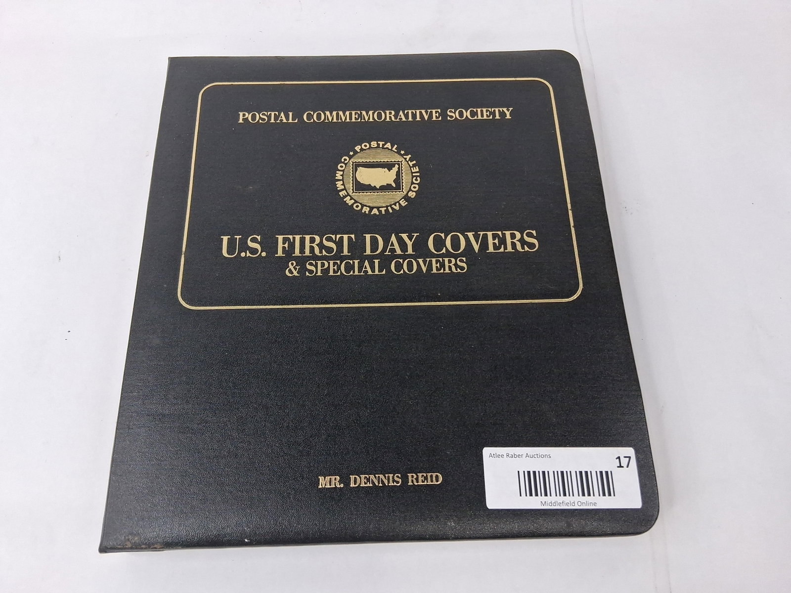 Postal Commemorative Soc. U.S. Covers: A collection of United States First Day Covers (FDCs) housed in a black padded leatherette three-ring binder, produced by the Postal Commemorative Society. The front cover is gold-stamped with the
