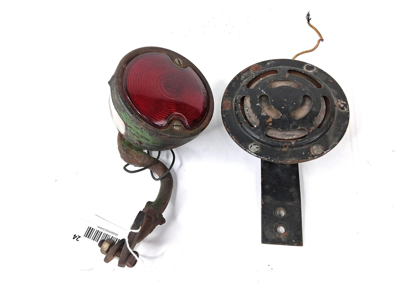 Vtg Sparton SA Horn & Naco Tail Light: This lot consists of two automotive components. The first is a rear tail light assembly featuring a circular stamped housing with a red lens embossed with the code L 5 3 1 7. The housing has a clear