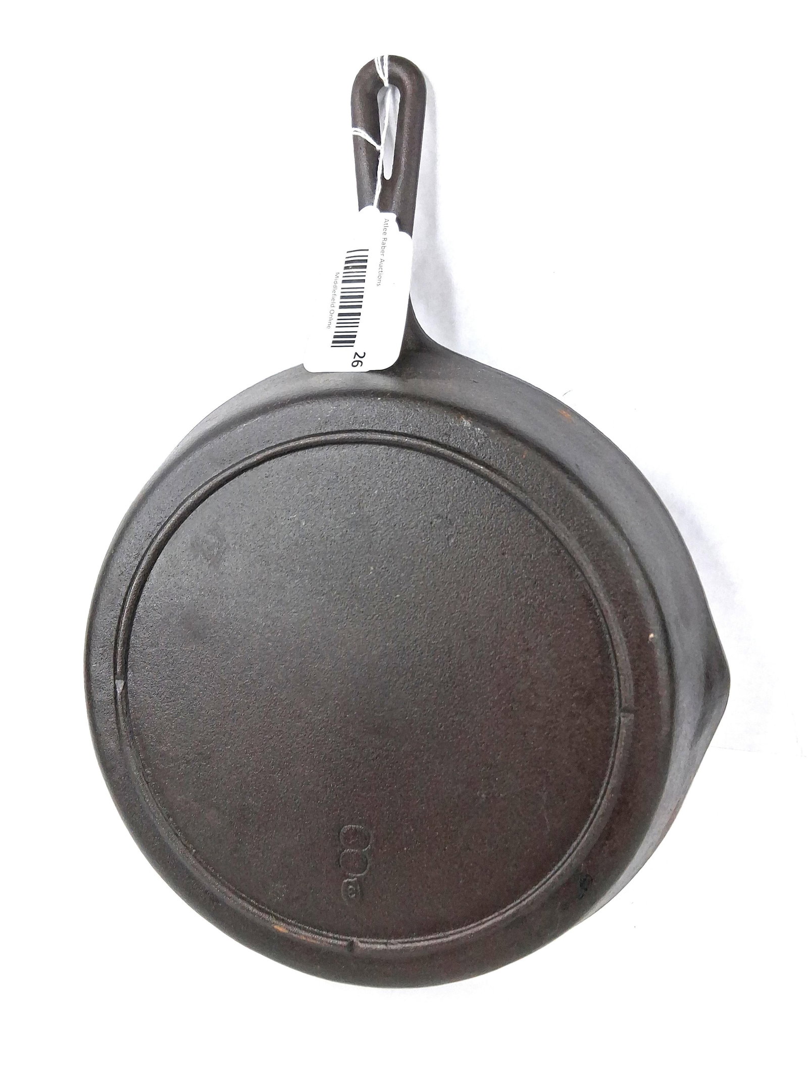 Lodge Vtg Three-Notch Cast Iron Skillet: This cast iron skillet was manufactured by the Lodge Manufacturing Co. in the United States. The pan features a round body with two side pour spouts and a teardrop-shaped handle with a hanging hole.