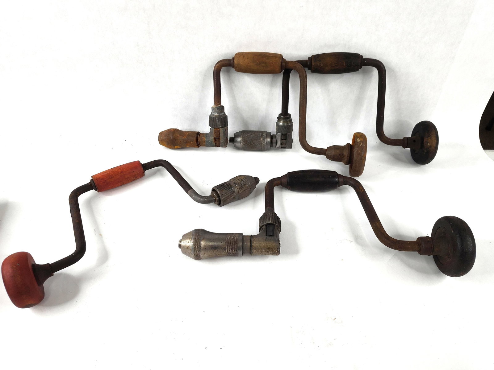 4 Stanley & Western Union Hand Braces: This group of four antique woodworking hand braces dates from the late 19th to early 20th century. The collection includes three ratcheting bit braces and one non-ratcheting sweep brace. One ratchet