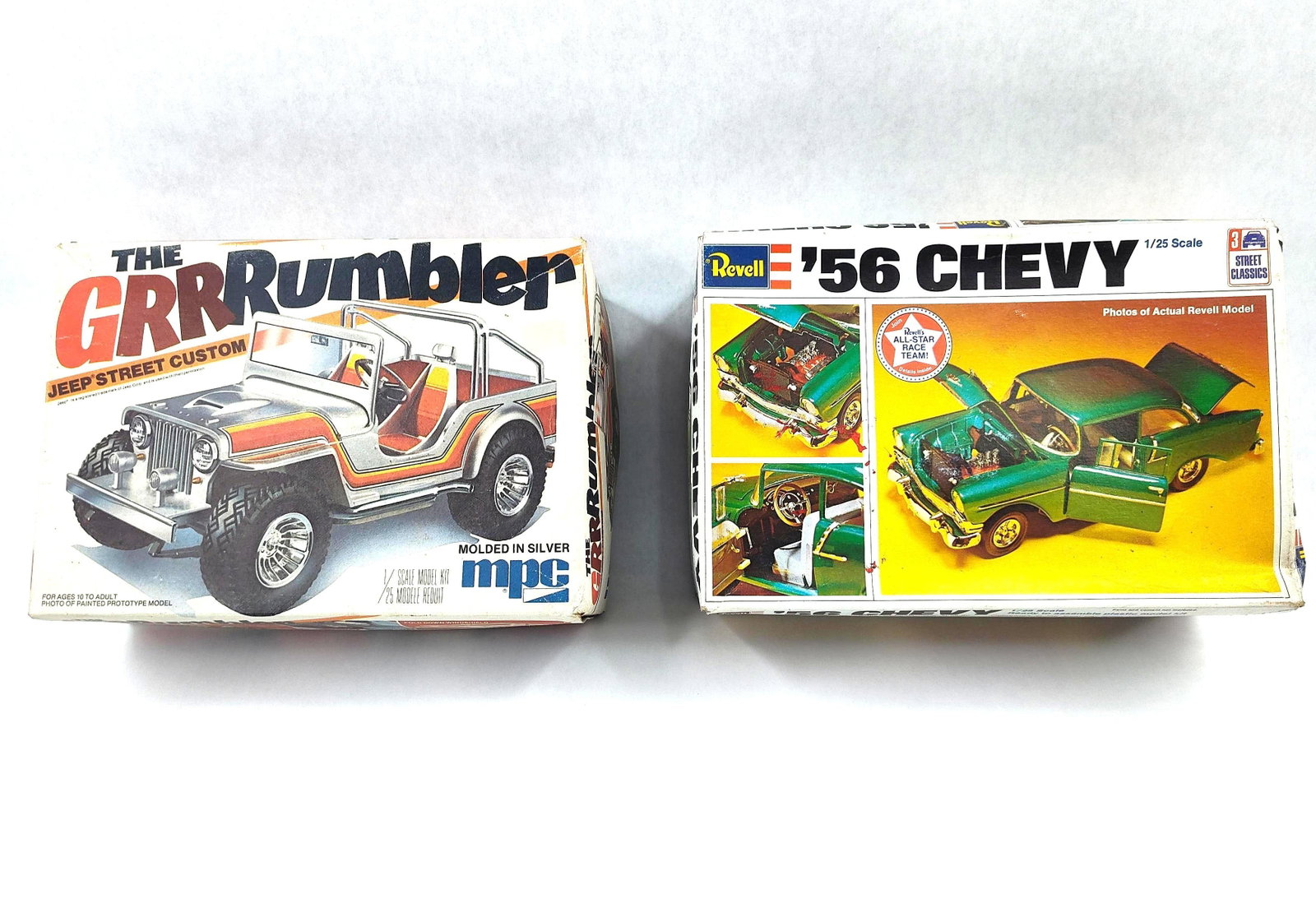 ) 56(2) (1) Chevy(5) (1) Kits(4): This lot features two plastic model car kits in 1/25 scale from manufacturers MPC and Revell. The first kit is The GRR Rumbler Jeep Street Custom produced by MPC (Model Products Corp), identified by m