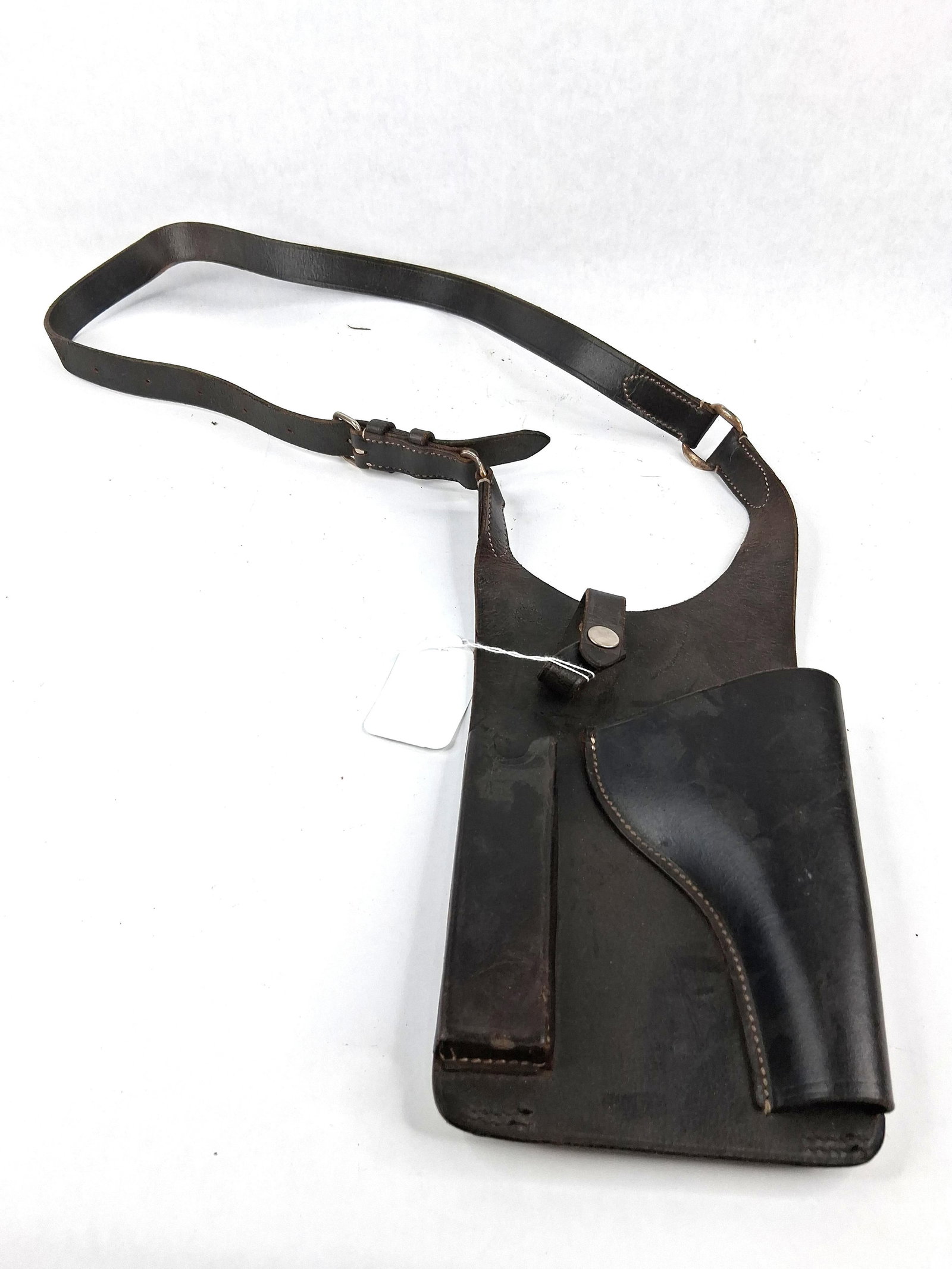 Soviet Stechkin APS Shoulder Holster 64: A Soviet Cold War-era leather shoulder holster designed for the Stechkin APS (Avtomaticheskiy Pistolet Stechkina) machine pistol. The item is constructed from heavy tanned leather dyed dark brown and