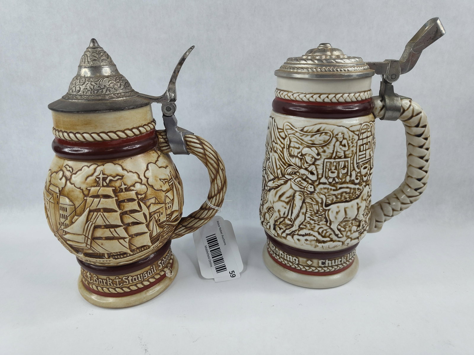 Pair Avon Ceramarte Lidded Beer Steins: Two collectible ceramic beer steins produced by Ceramarte in Brazil exclusively for Avon Products, Inc. The first vessel, produced in 1977, features a Great Ships maritime theme. The body showcases