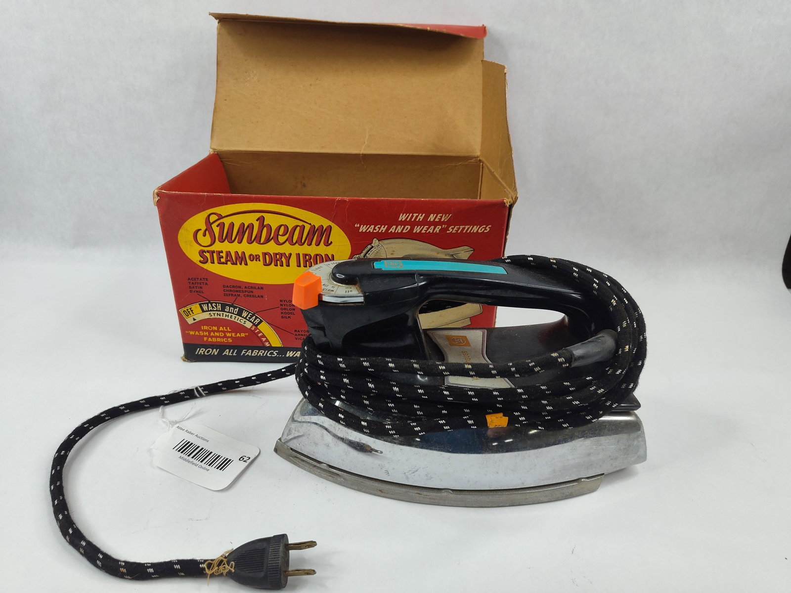 Westinghouse Steam & Dry Iron HS-29-1: A electric steam or dry iron manufactured by Westinghouse Electric Corp. The iron features a chrome-plated metal body and soleplate with a black molded plastic handle. The handle is accented with a