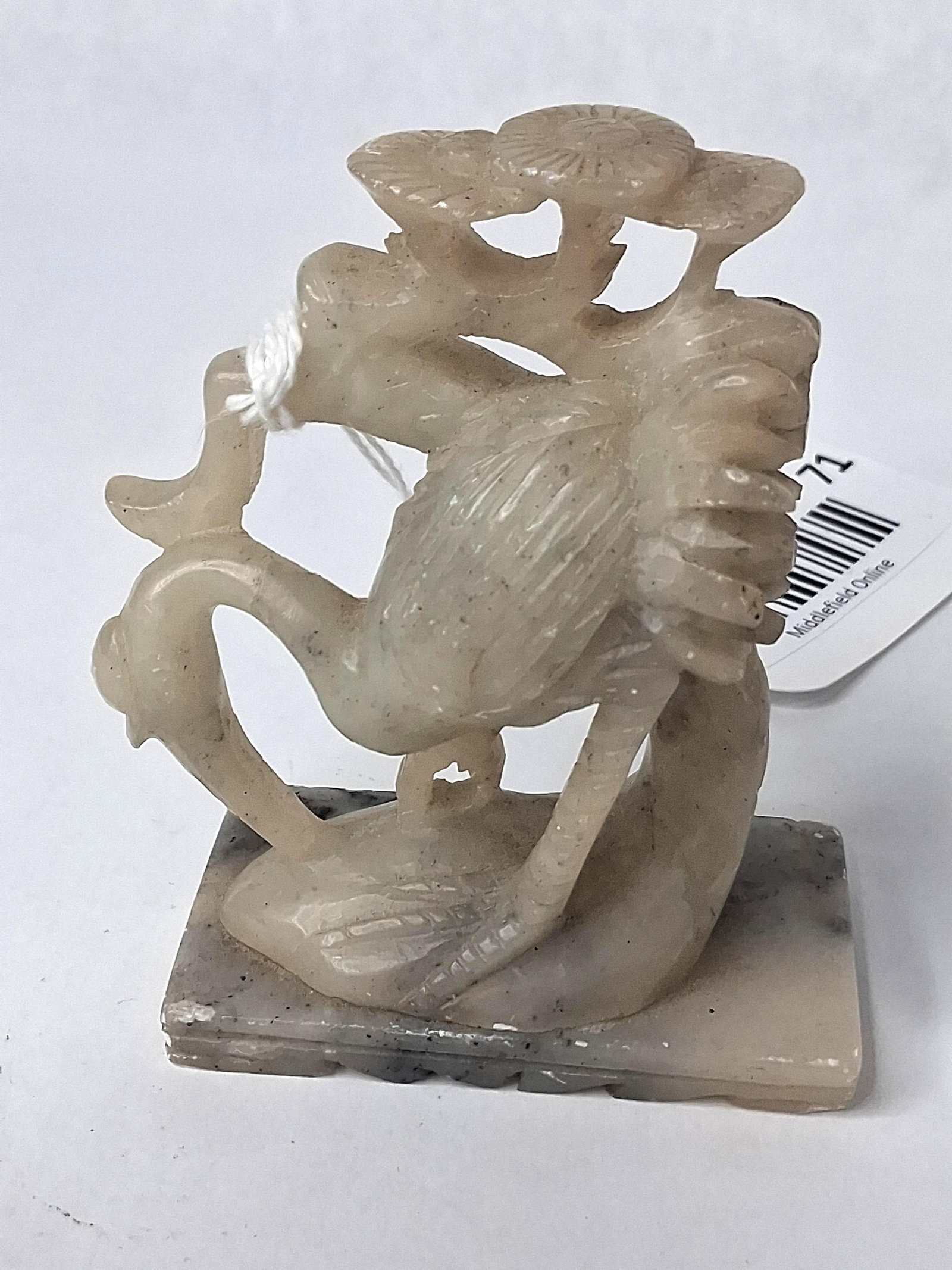 Chinese Soapstone Crane & Pine Figurine: A Chinese hand-carved soapstone figurine depicting a crane alongside traditional symbols of longevity. The central crane is carved with its neck curved backward, standing beside stylized pine