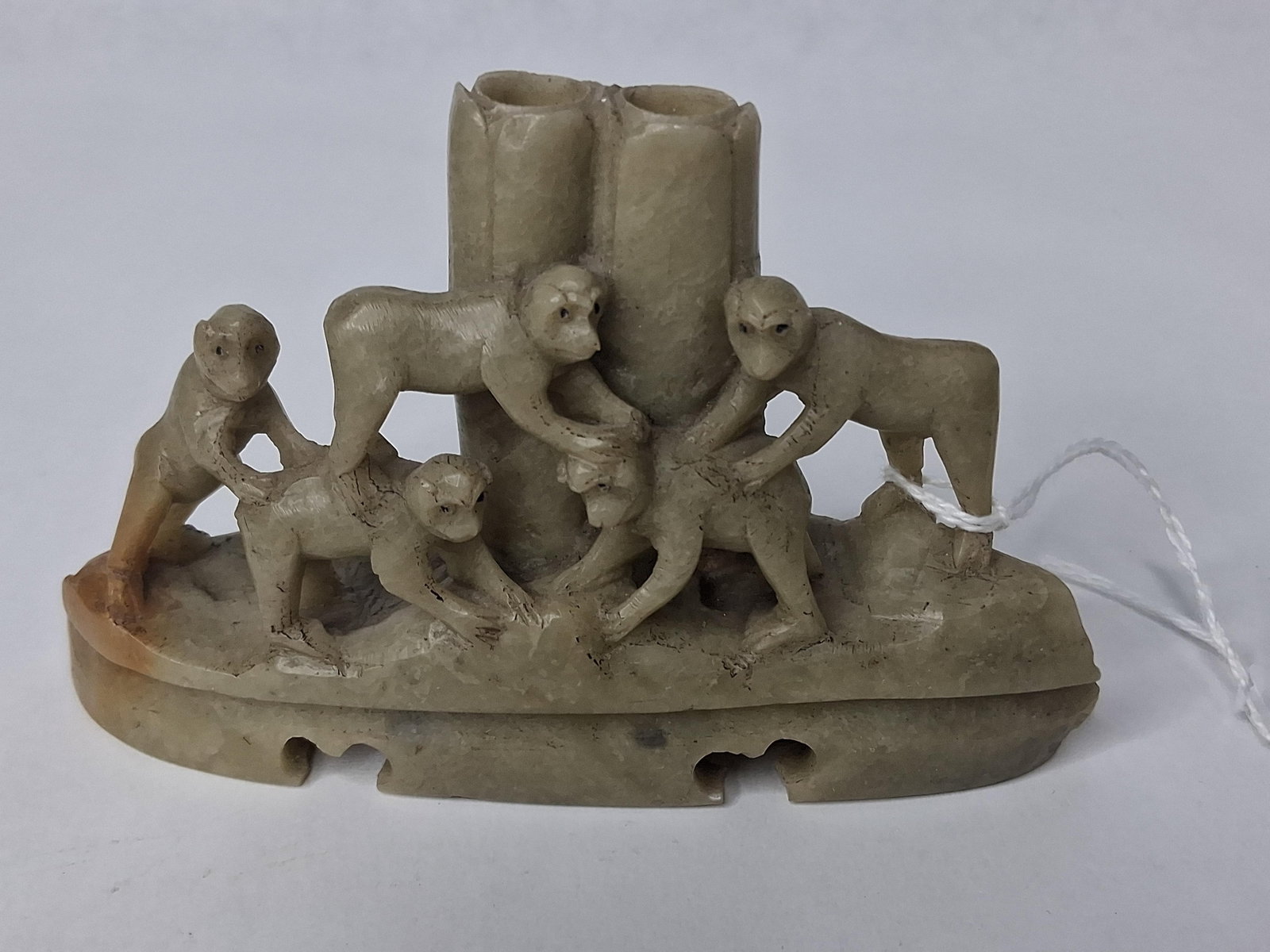 Chinese Soapstone 5 Monkey Brush Pot: A Chinese hand-carved soapstone double brush pot featuring five monkeys. The piece is sculpted from a single block of light celadon-grey soapstone characterized by a waxy luster and natural
