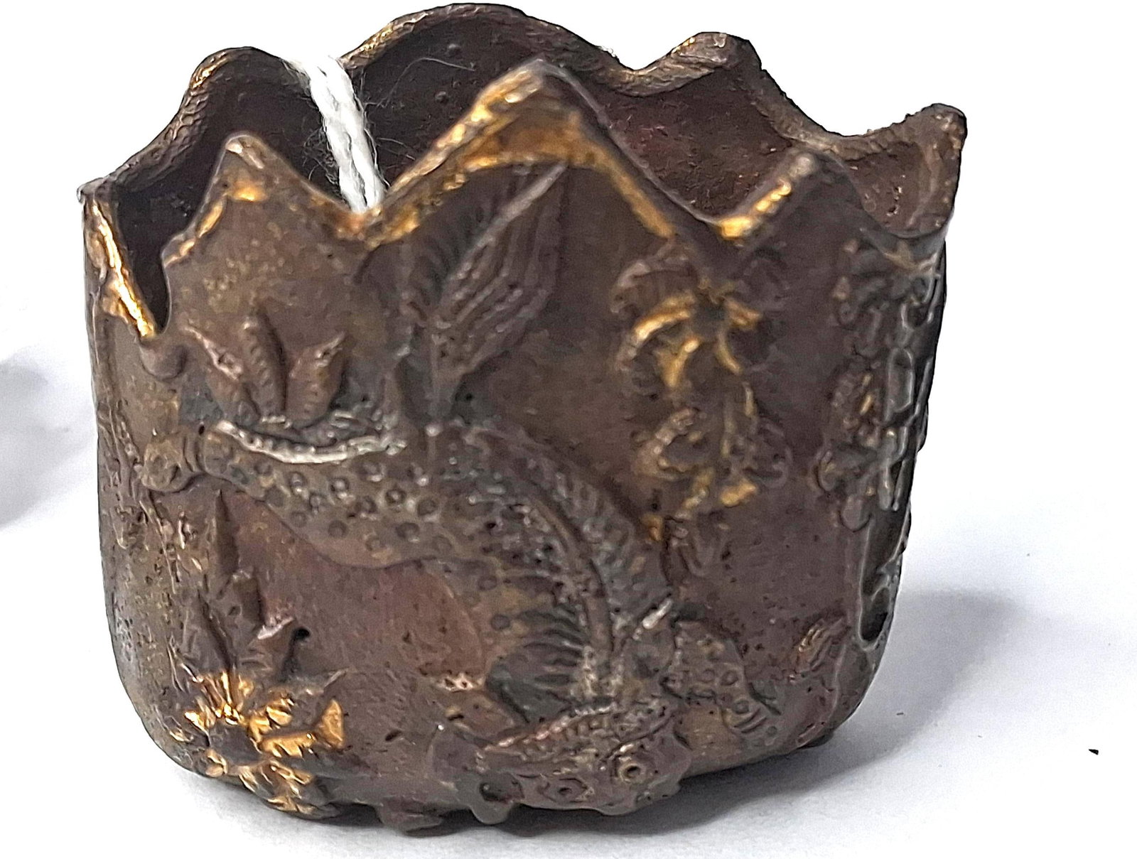 Chinese Parcel-Gilt Dragon Fitting: This is a miniature cast-bronze decorative vessel, likely of Chinese origin, featuring high-relief decoration and parcel-gilding. The object is designed with a wide, irregular opening and a jagged,