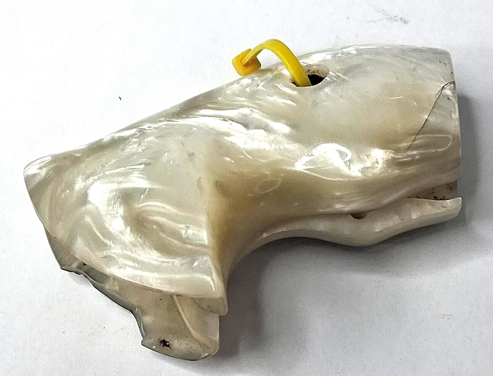 Pair Bird's Head Mother-of-Pearl Grips: A pair of bird's head pattern pistol grip panels crafted from genuine mother-of-pearl. The panels exhibit characteristic natural iridescence and layered growth lines. The reverse of the panels