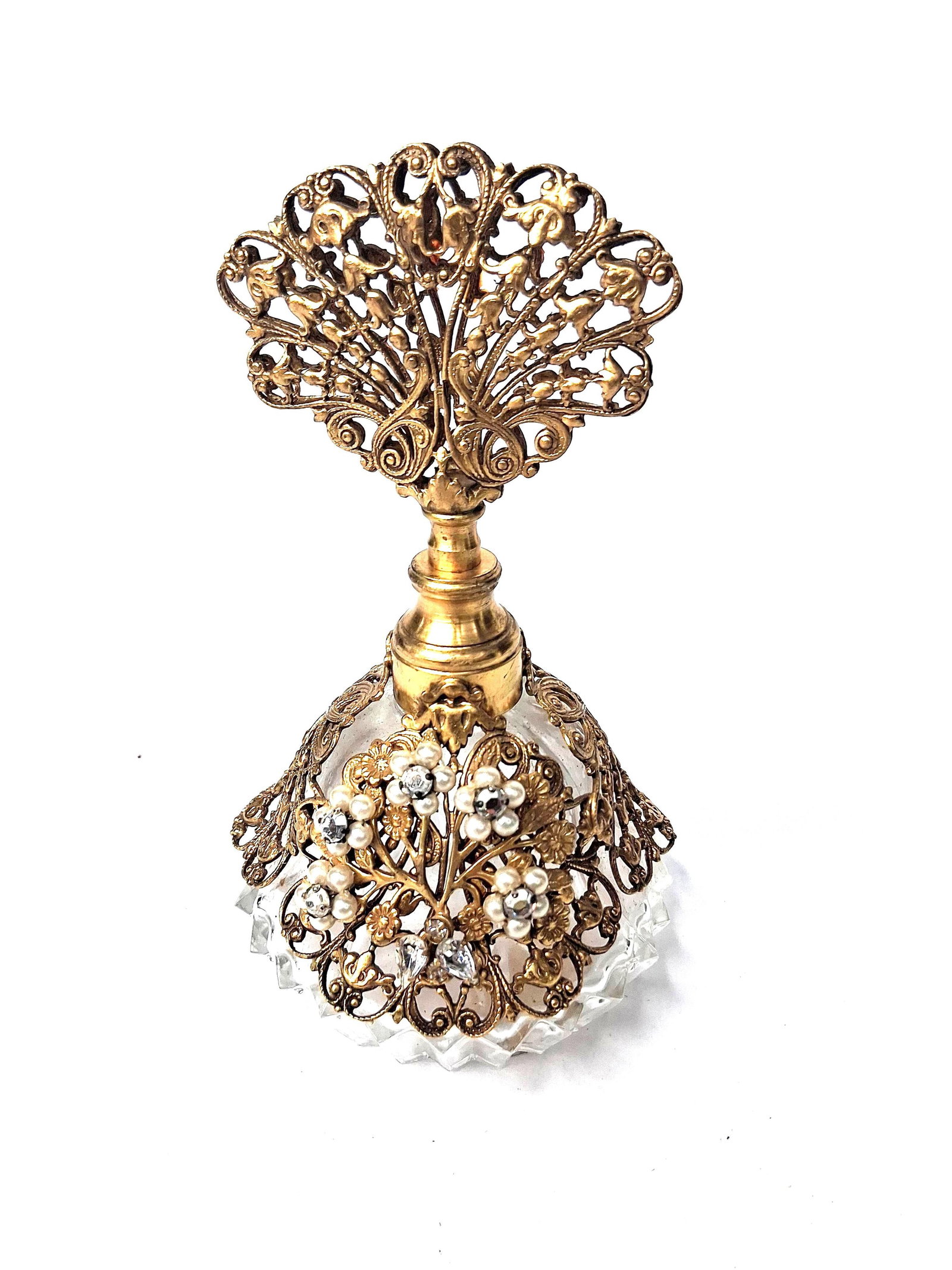 Robert Ormolu Filigree & Glass Perfume: This mid-century perfume bottle is part of the Boutique collection produced by Originals by Robert. The bottle is constructed with a clear faceted glass base featuring a molded starburst design on the