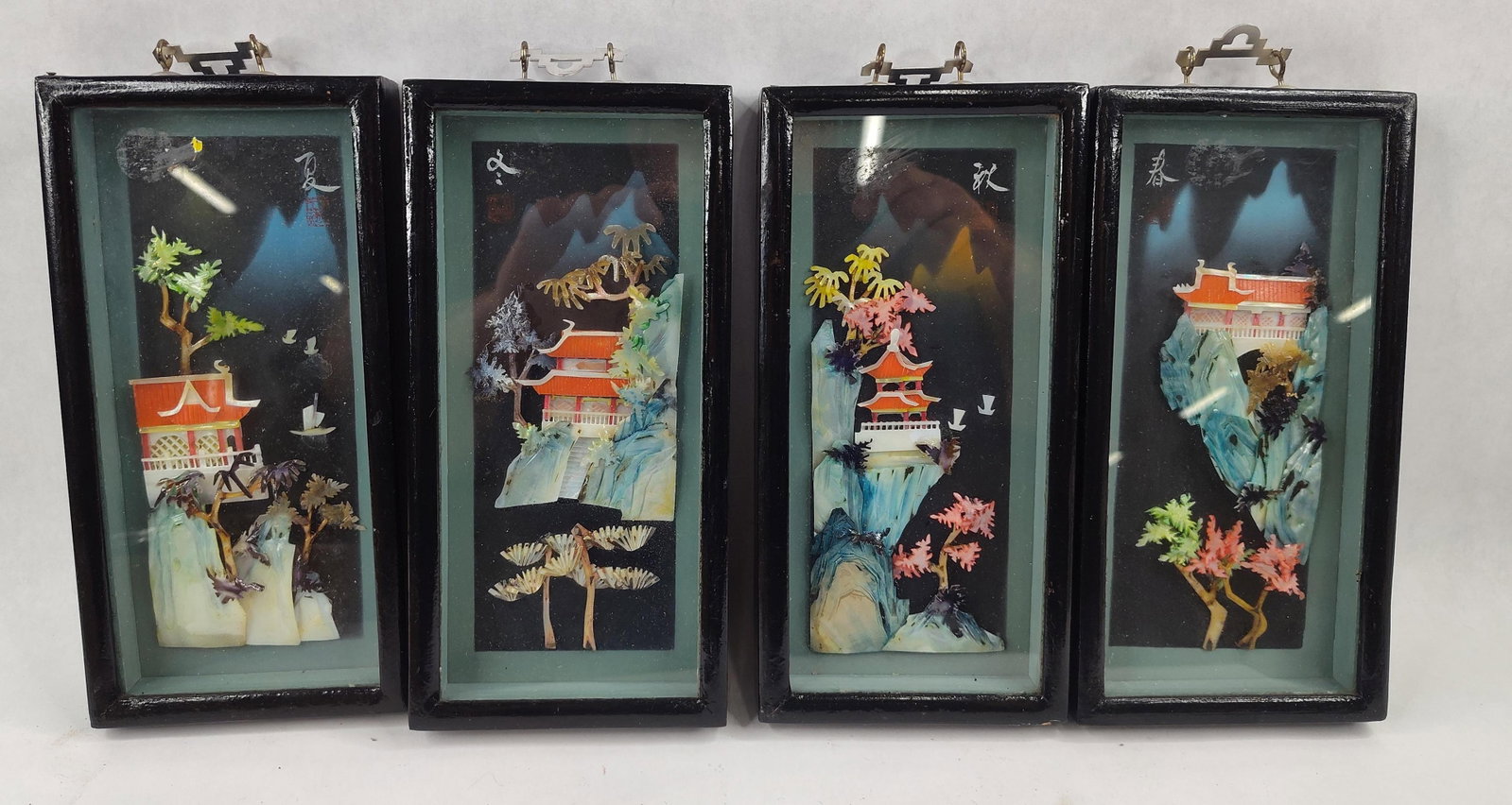 Set 4 Chinese Carved Shell Reliefs: A set of four Chinese shadowbox relief pictures representing the four seasons, likely produced as export decorative art in the mid-20th century. Each scene is constructed with high-relief carved
