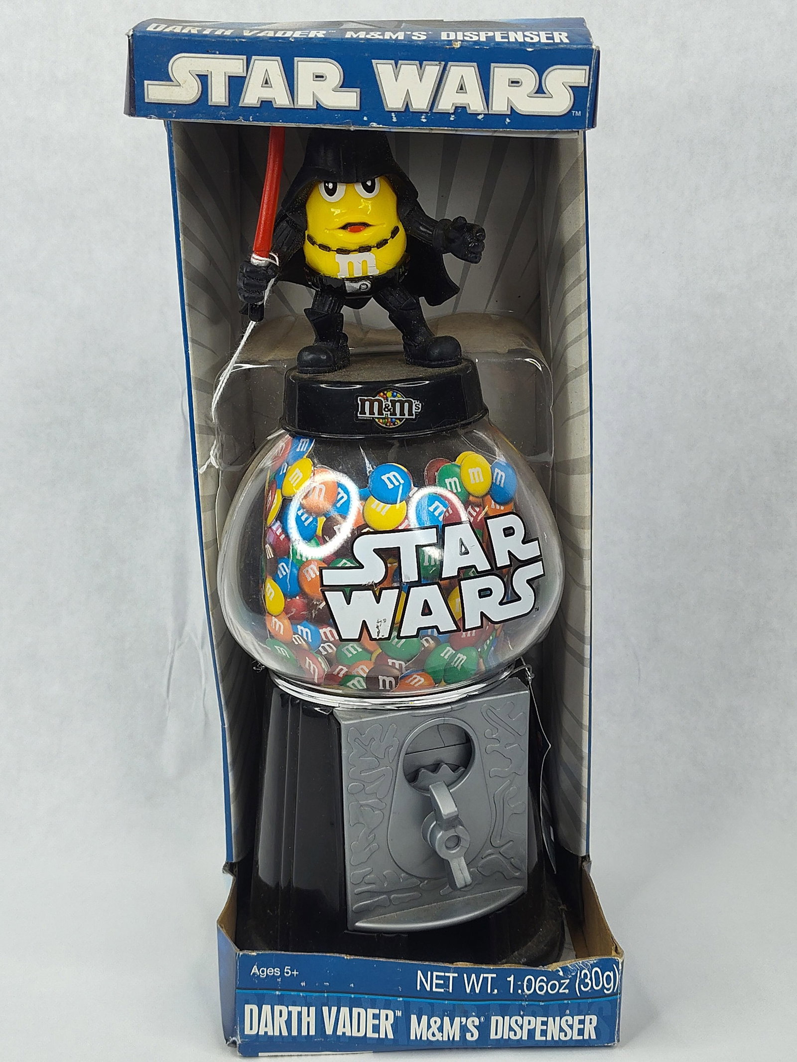 CandyRific Darth Vader M&M'S Dispenser: This novelty candy dispenser was produced by CandyRific in 2010 as a licensed Star Wars and M&M'S crossover collectible. The dispenser features a yellow peanut M&M character dressed as Darth Vader, co