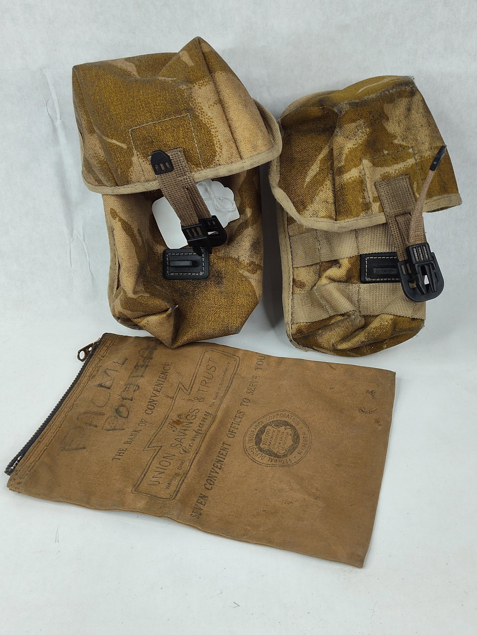 British Army Desert DPM Pouches & Bag: This lot features a trio of functional and collectible items, consisting of two British Army field pouches and a mid-century American canvas bank bag. The first item is a British Army PLCE (Personal
