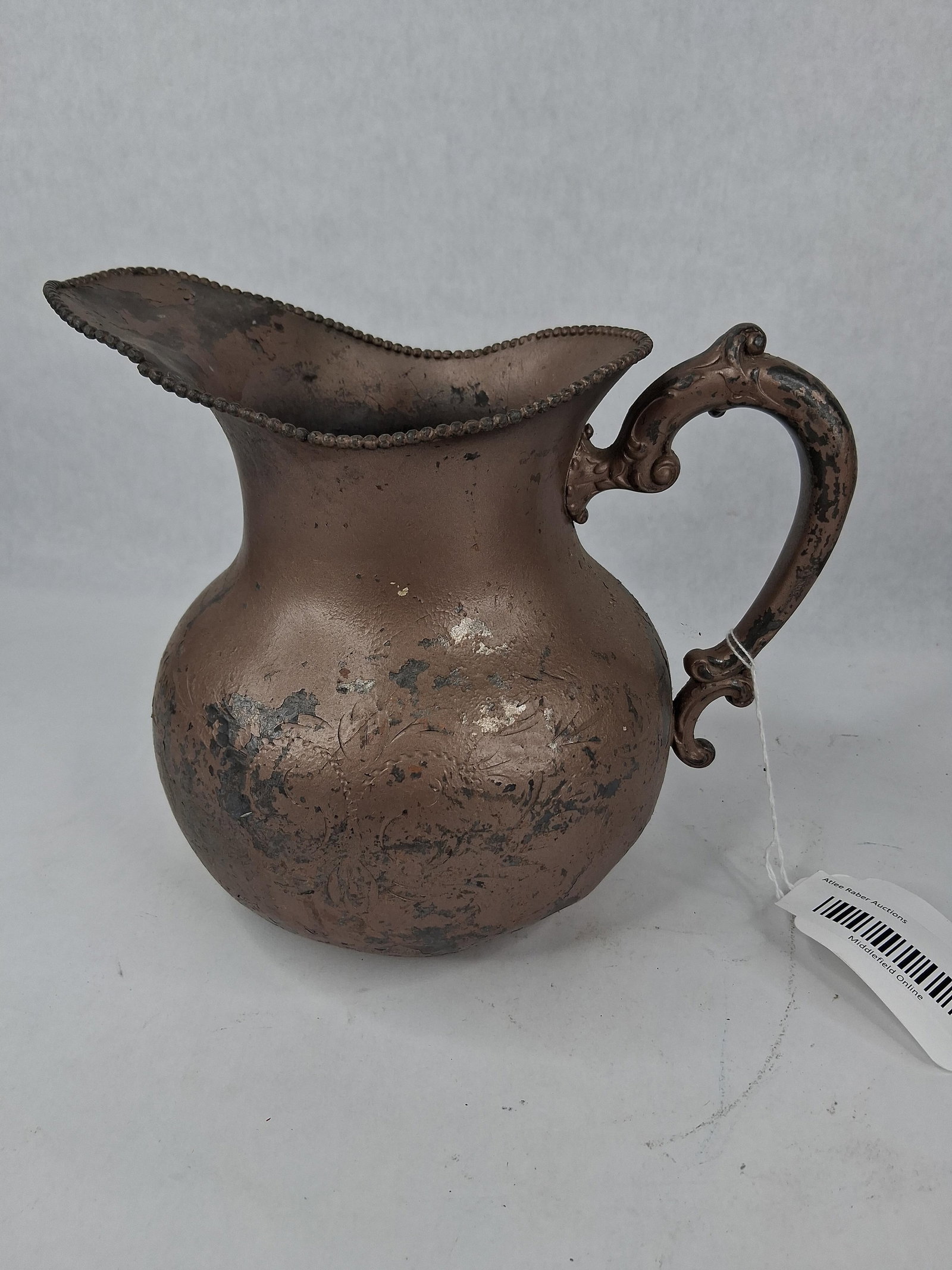 Middletown Plate Co. Victorian Pitcher: A late 19th-century water pitcher manufactured by the Middletown Plate Co. of Middletown, Connecticut. The piece features a bulbous form with a wide flared neck and a prominent pinched spout. The rim