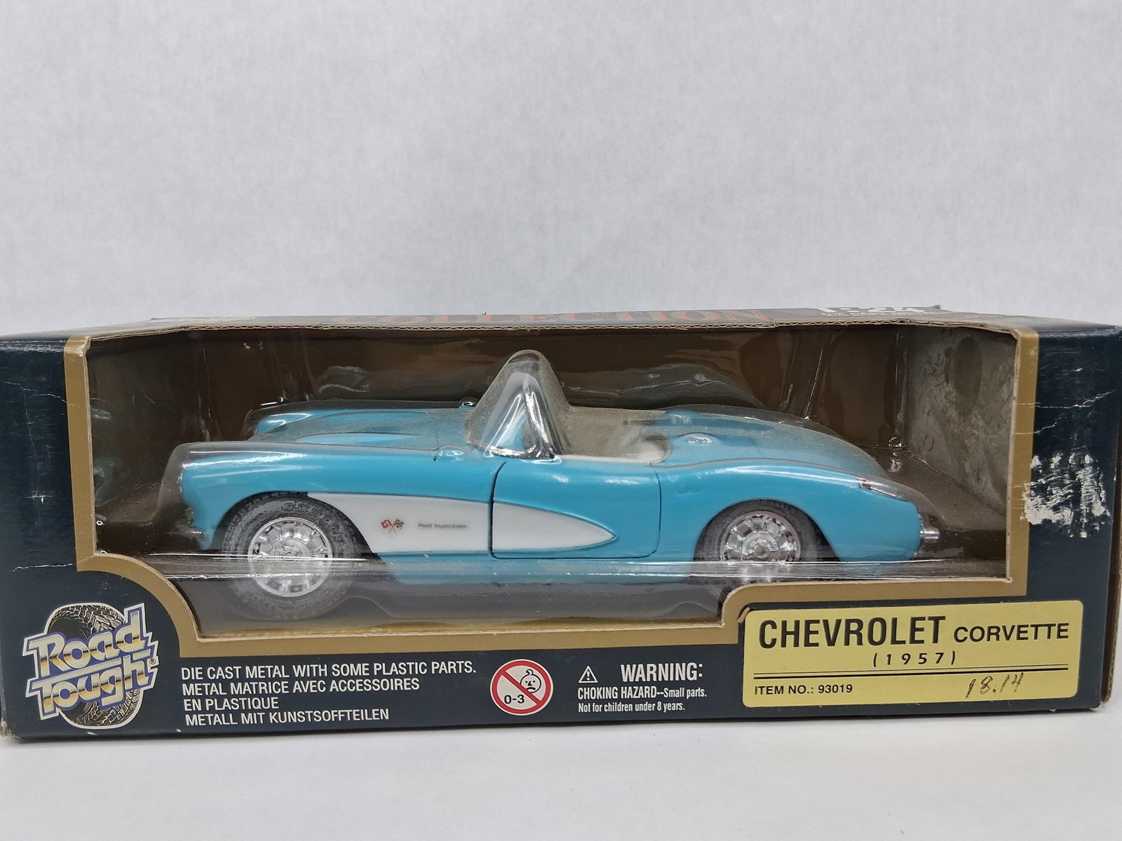 Road Tough 1957 Chevrolet Corvette Box: A Road Tough Collection model of a 1957 Chevrolet Corvette. This 1:24 scale replica is constructed from die-cast metal with plastic components. The car is finished in a light blue exterior color accen