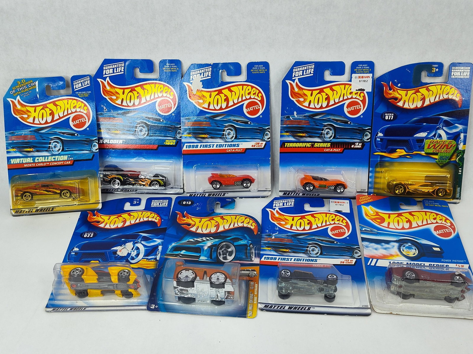 9 Mattel Hot Wheels Die-Cast Toy Cars: This collection consists of nine Mattel Hot Wheels die-cast toy cars, each preserved in its original unopened factory packaging. The assortment features various releases from 1995 through 2004, includ