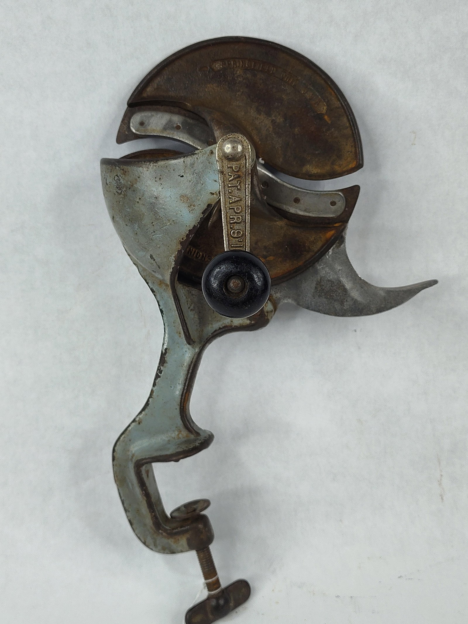 Eagle Engineering Co Rotary Slicer: An antique bench-mounted hand-cranked rotary slicer produced by The Eagle Engineering Co. of Springfield, Ohio. The device is constructed from cast iron with steel blades and a wood or composition han