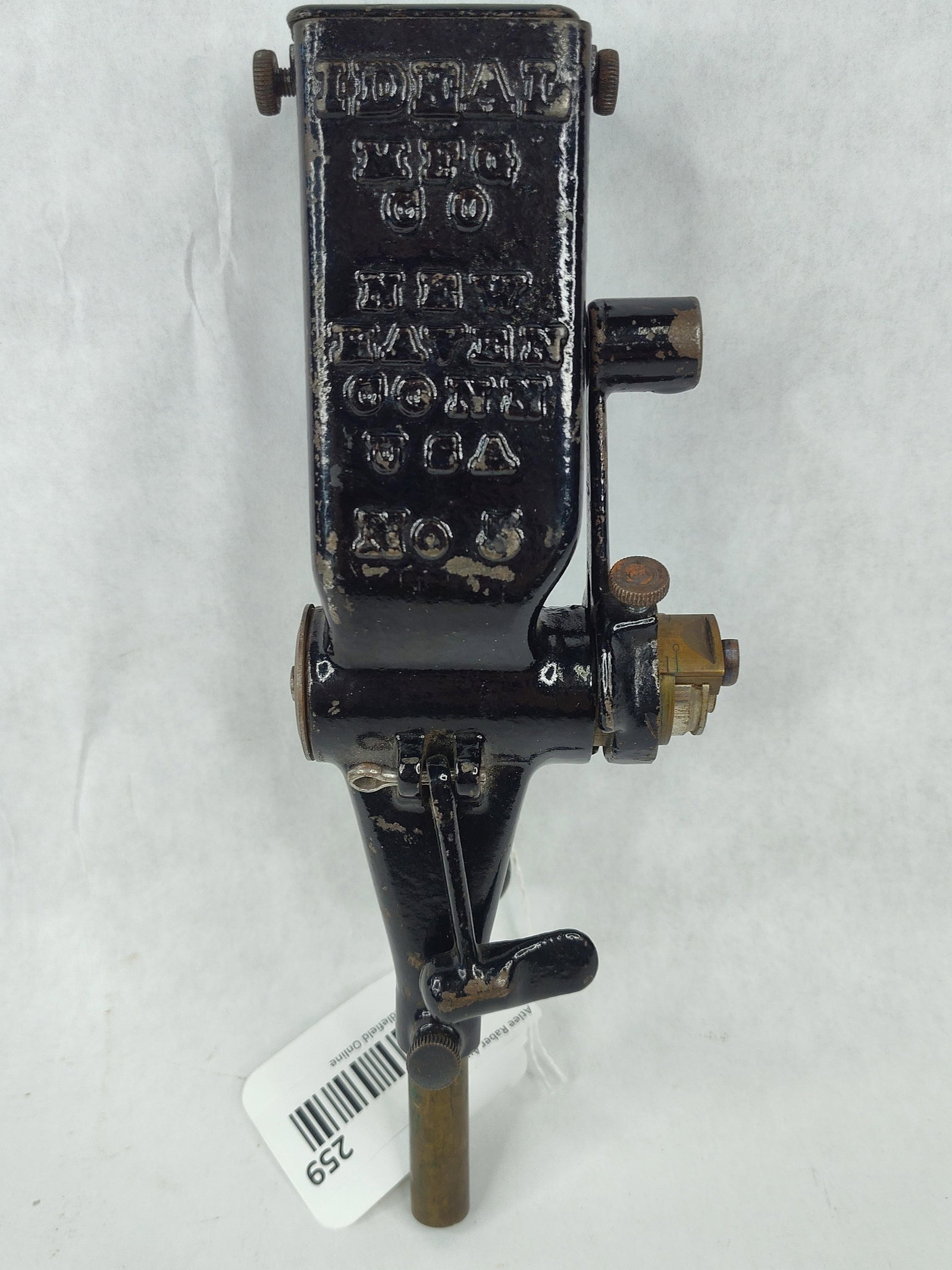Ideal Manufacturing No 5 Powder Measure: An antique Ideal No. 5 powder measure produced by the Ideal Manufacturing Company of New Haven, Connecticut. The unit is made of cast iron with a black japanned finish. The front face is embossed