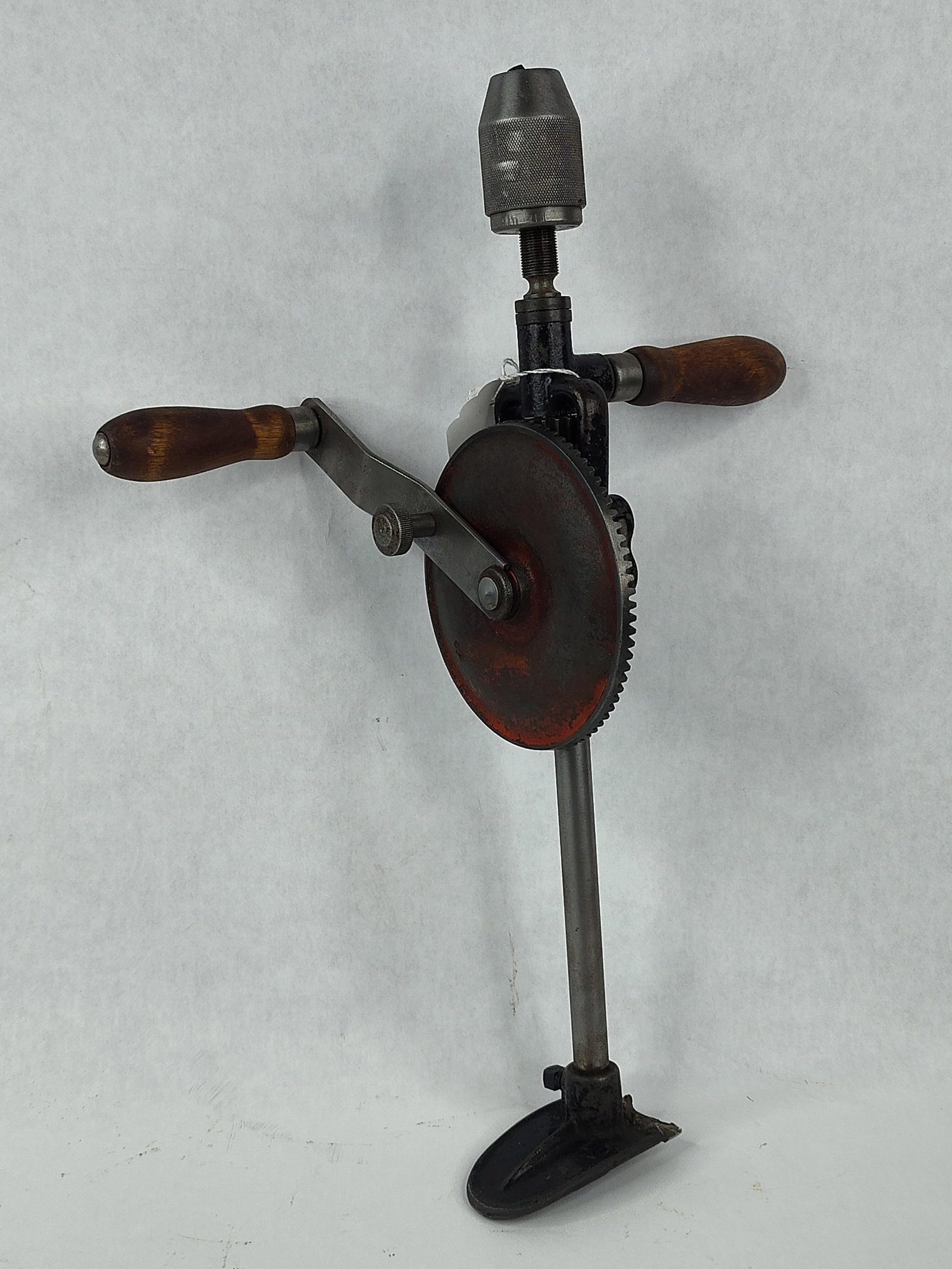 Millers Falls 120B 2-Speed Breast Drill: A Millers Falls No. 120B two-speed breast drill manufactured in Greenfield, Massachusetts. This industrial-grade hand tool features a cast iron frame with a black finish and a large, red-painted