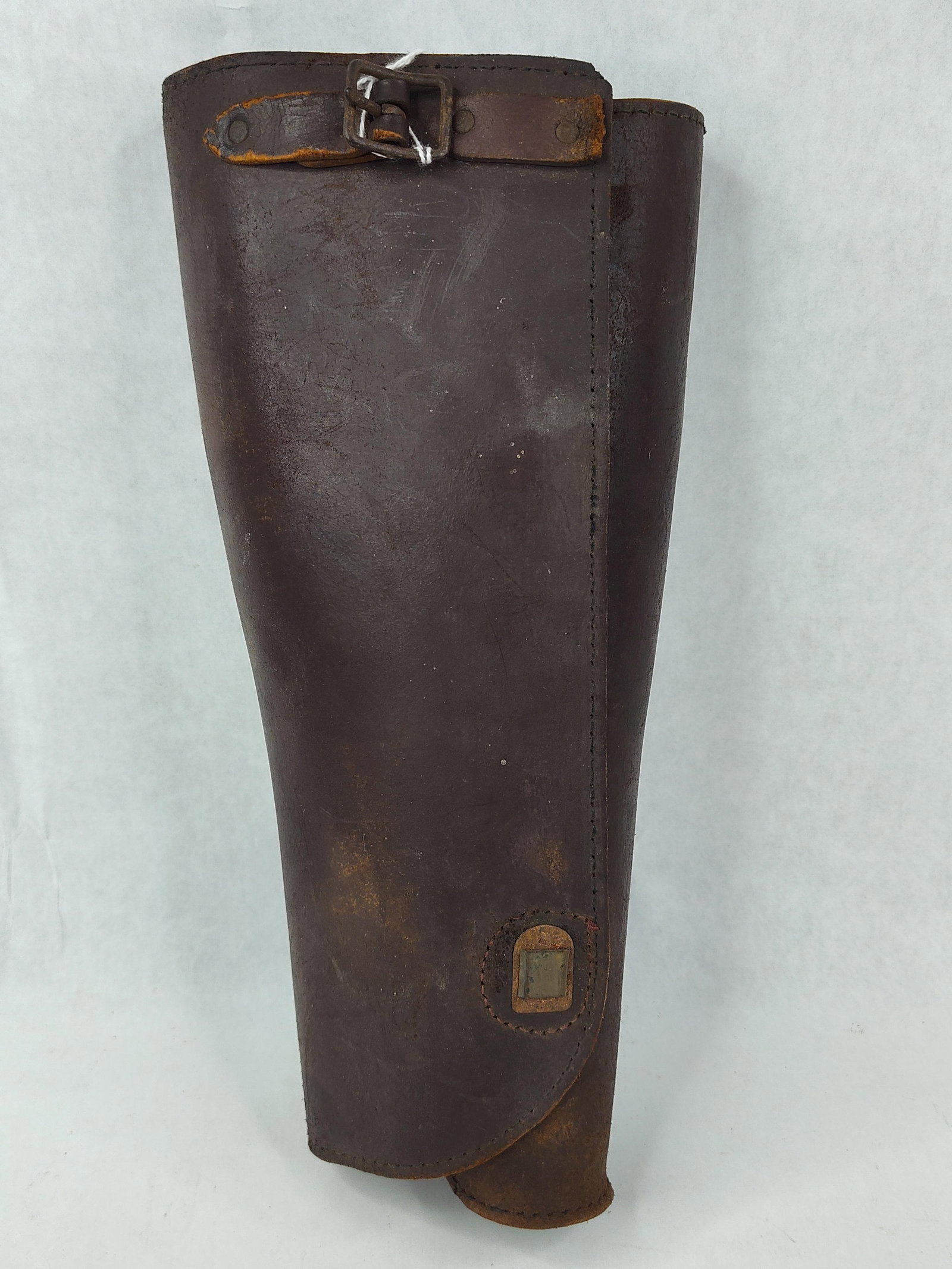 British Mounted Service Leather Legging: This is a single brown leather legging of the pattern utilized by British and Commonwealth forces during the World War I and World War II periods. These leggings were standard issue for mounted