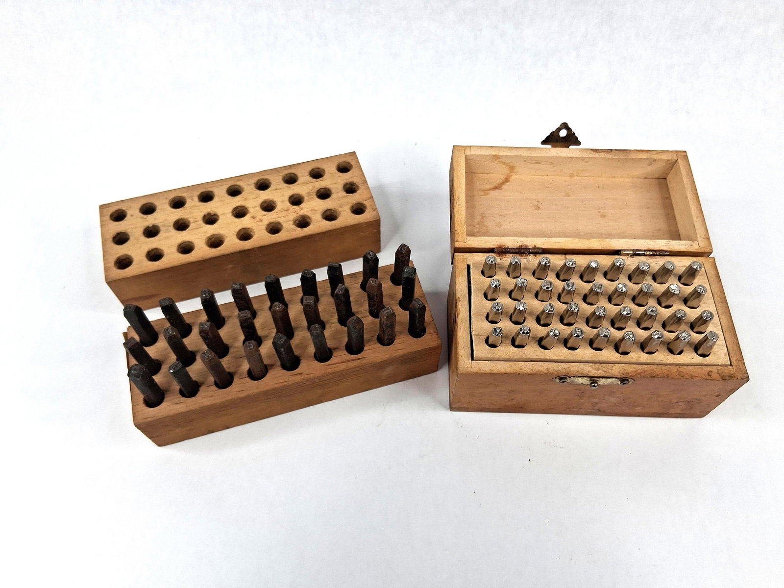 Young Bros Steel Letter & Number Stamps: This lot features two sets of industrial steel marking stamps manufactured by Young Bros. Stamp Works, Inc. of Muscatine, Iowa. The stamps are designed to produce 1/8 inch (3.2 mm) characters. One