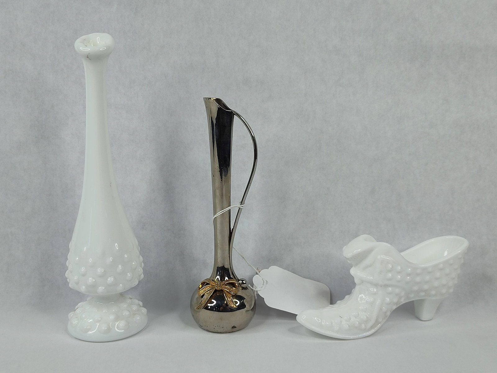 Fenton Hobnail Milk Glass & Silver Trio: This lot consists of a trio of decorative items including two pieces of Fenton Art Glass and a silver-plated miniature. The glass items are crafted from white milk glass in the hobnail pattern. This i