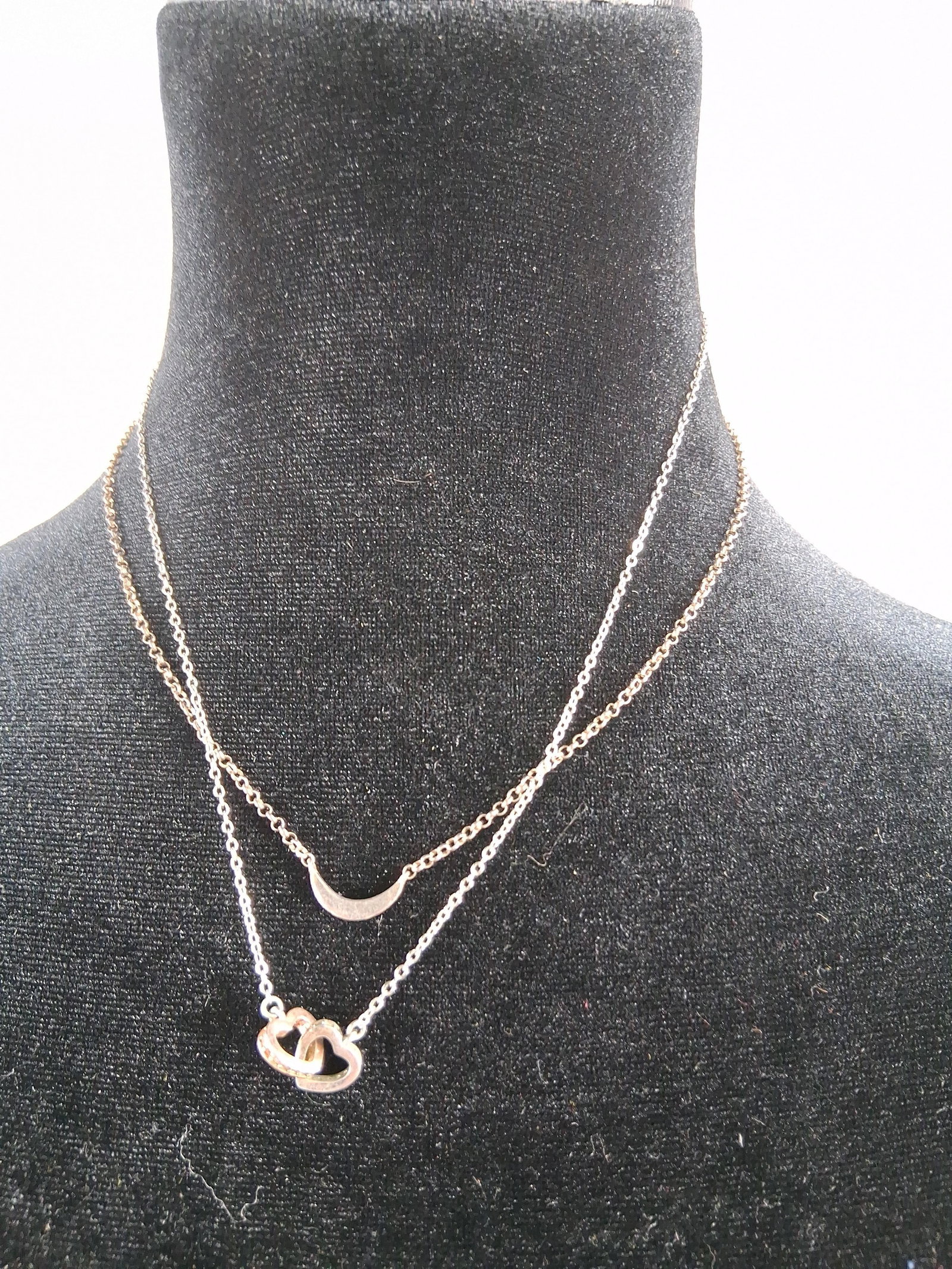Str. Two-Tone Heart & Moon Necklace: A double-strand layered necklace crafted from sterling silver with rose gold-tone accents. The piece consists of two layered fine cable chains connected to a single clasp mechanism. The shorter upper
